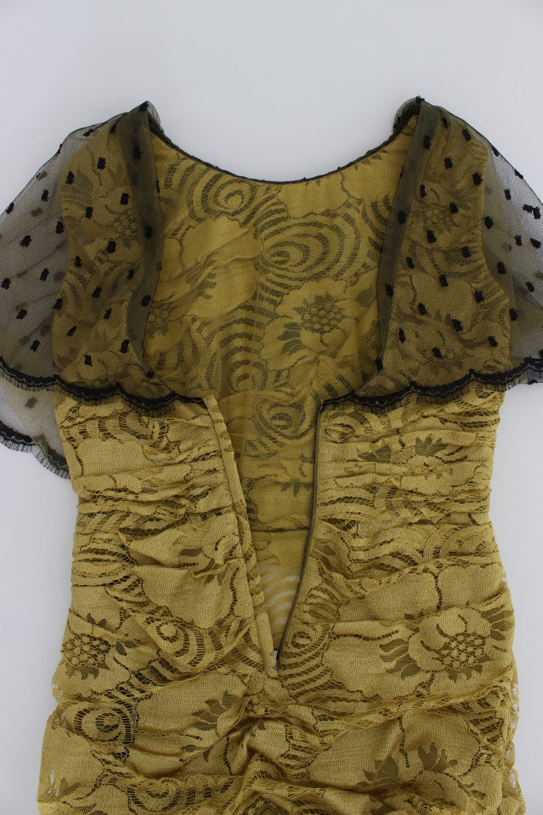 Yellow embroidered dress with black lace trim
