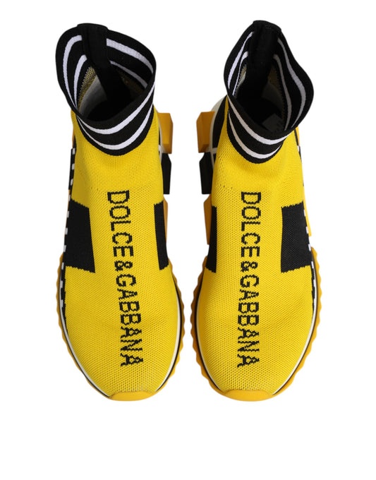 Yellow sneakers with black stripes and white lettering