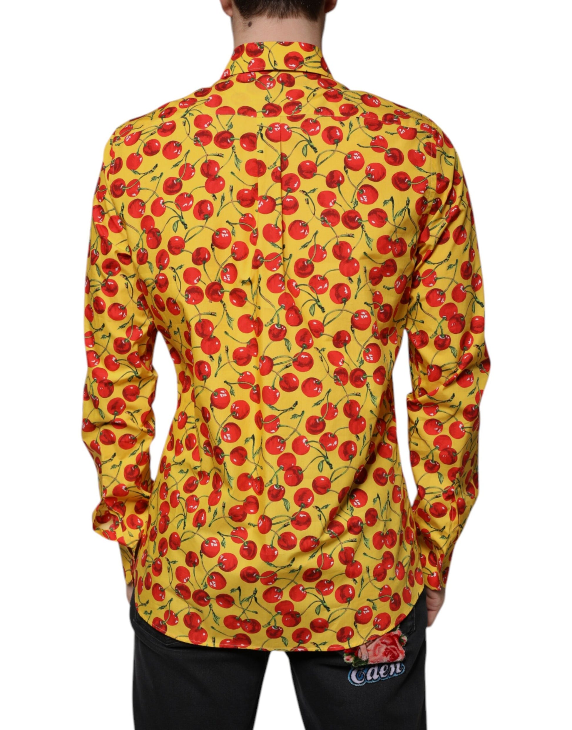 A yellow dress shirt with a cherry print pattern