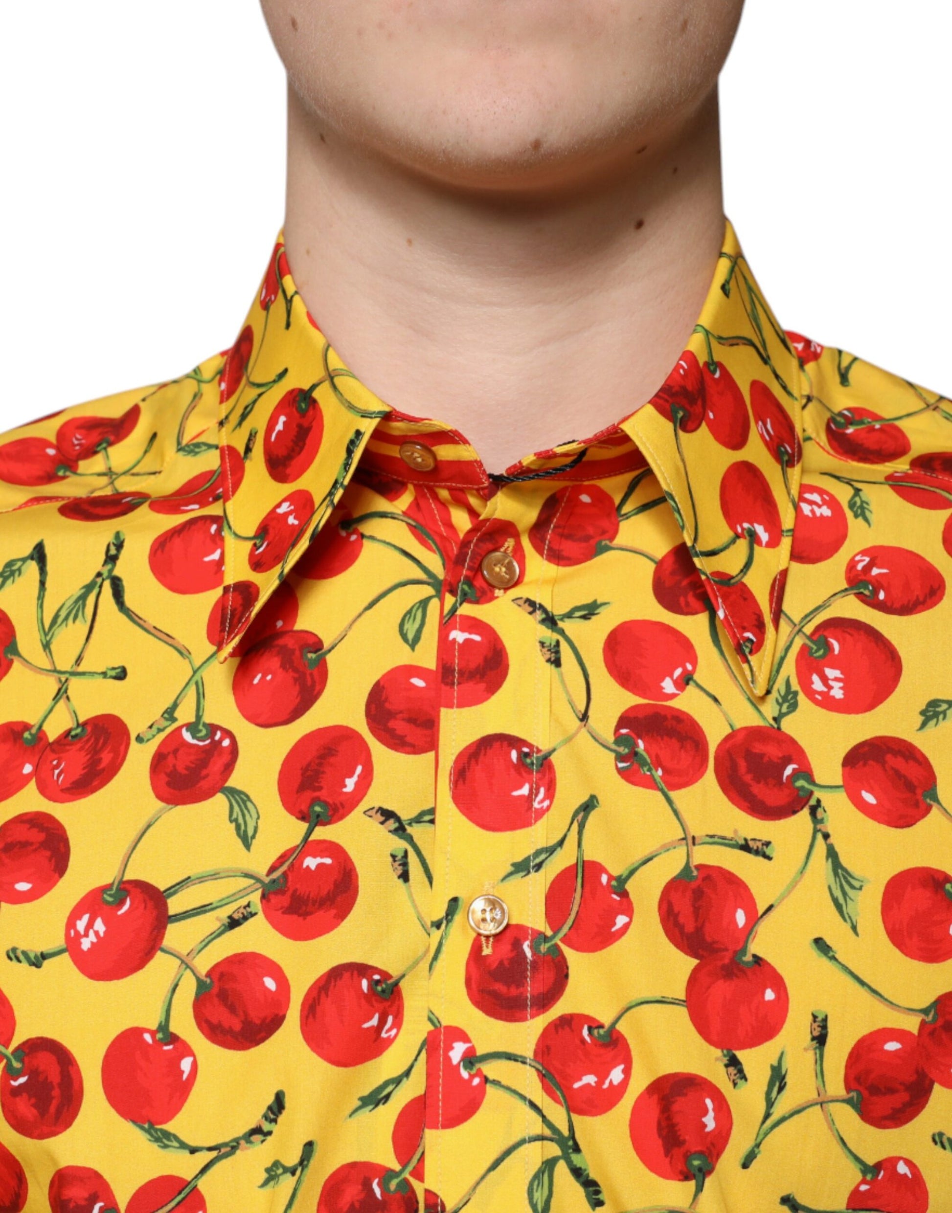 A yellow shirt with a cherry print