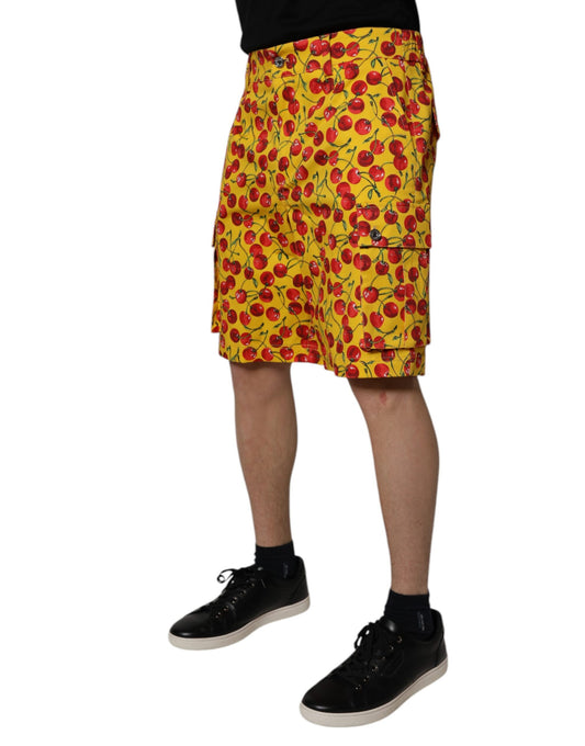 A pair of yellow shorts with cherry print, designed by Dolce & Gabbana