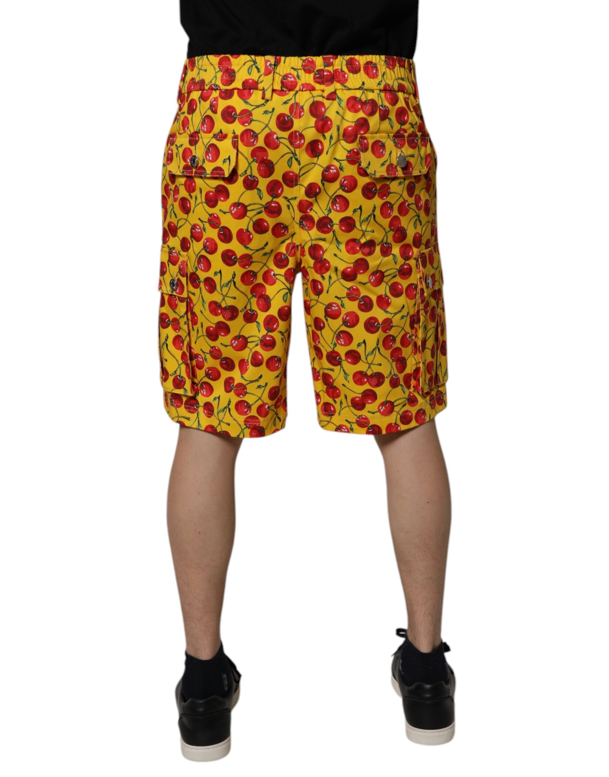A pair of men's shorts with a yellow cherry print on a white background