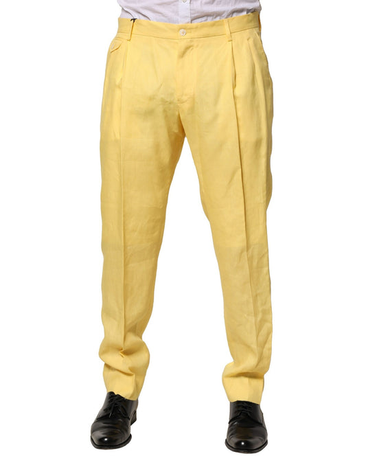 A pair of yellow men's trousers with a tapered design, featuring a flax fabric