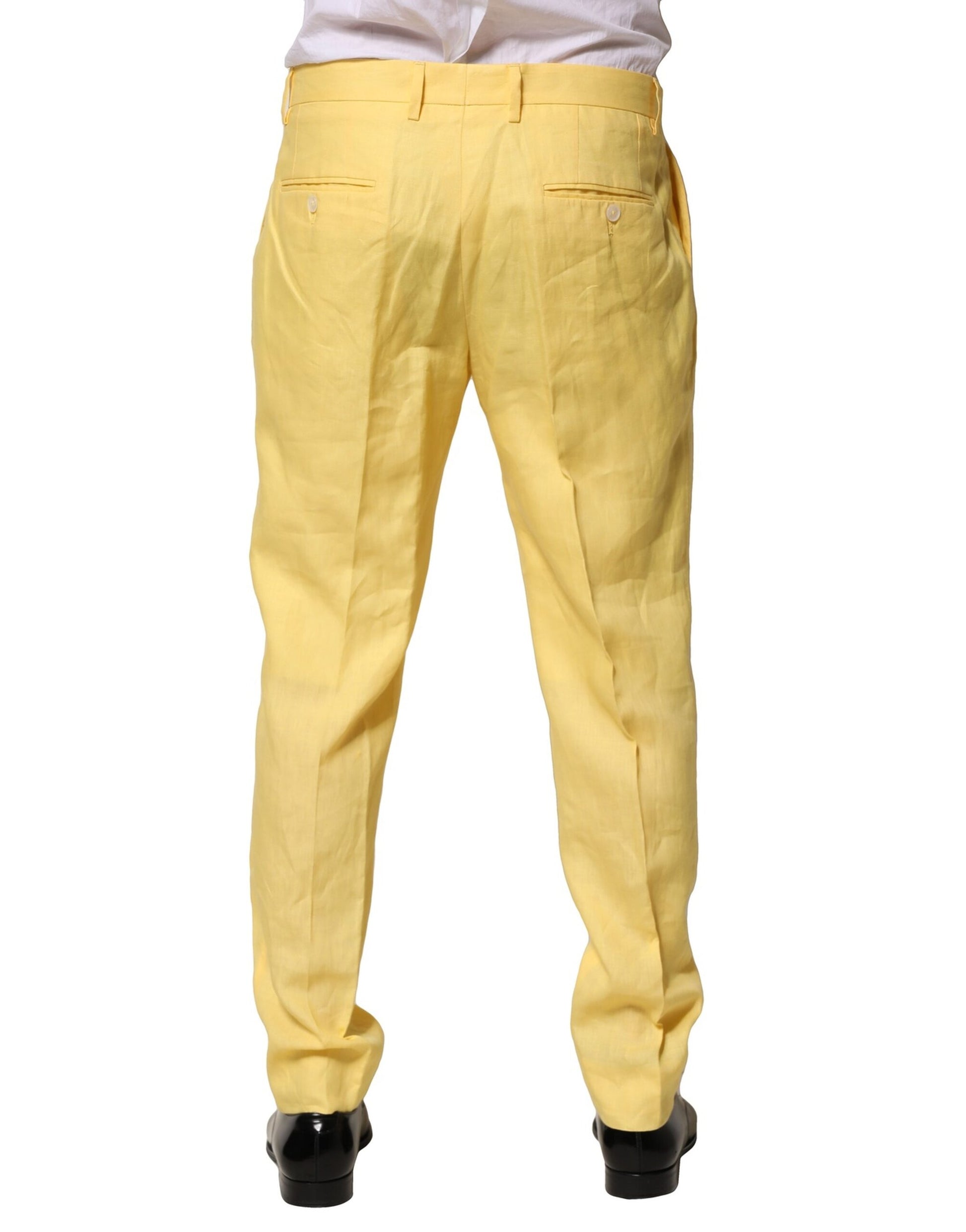 A pair of men's yellow flax tapered dress pants by Dolce & Gabbana