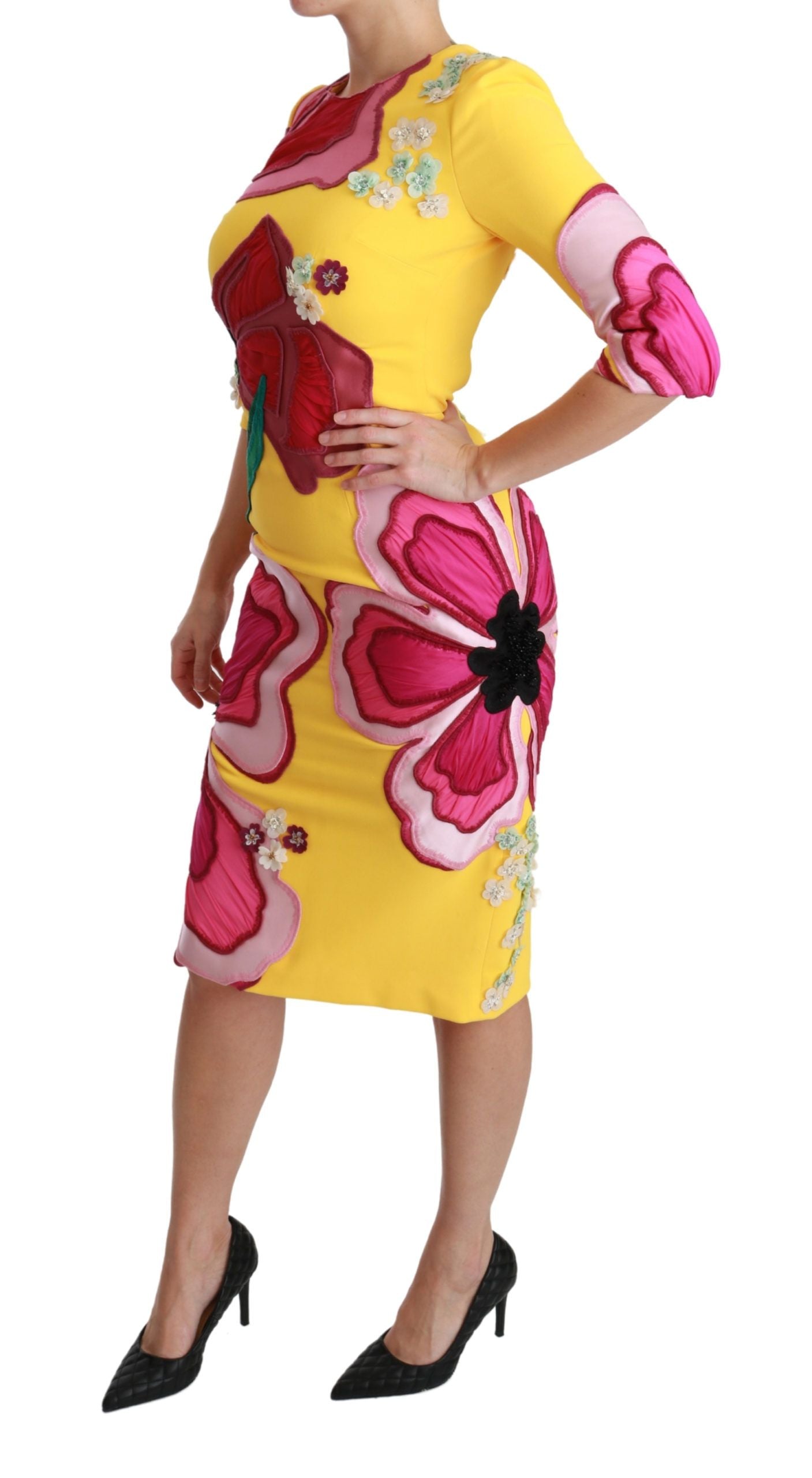 A yellow floral crystal bodycon sheath dress with a fitted silhouette and embellishments