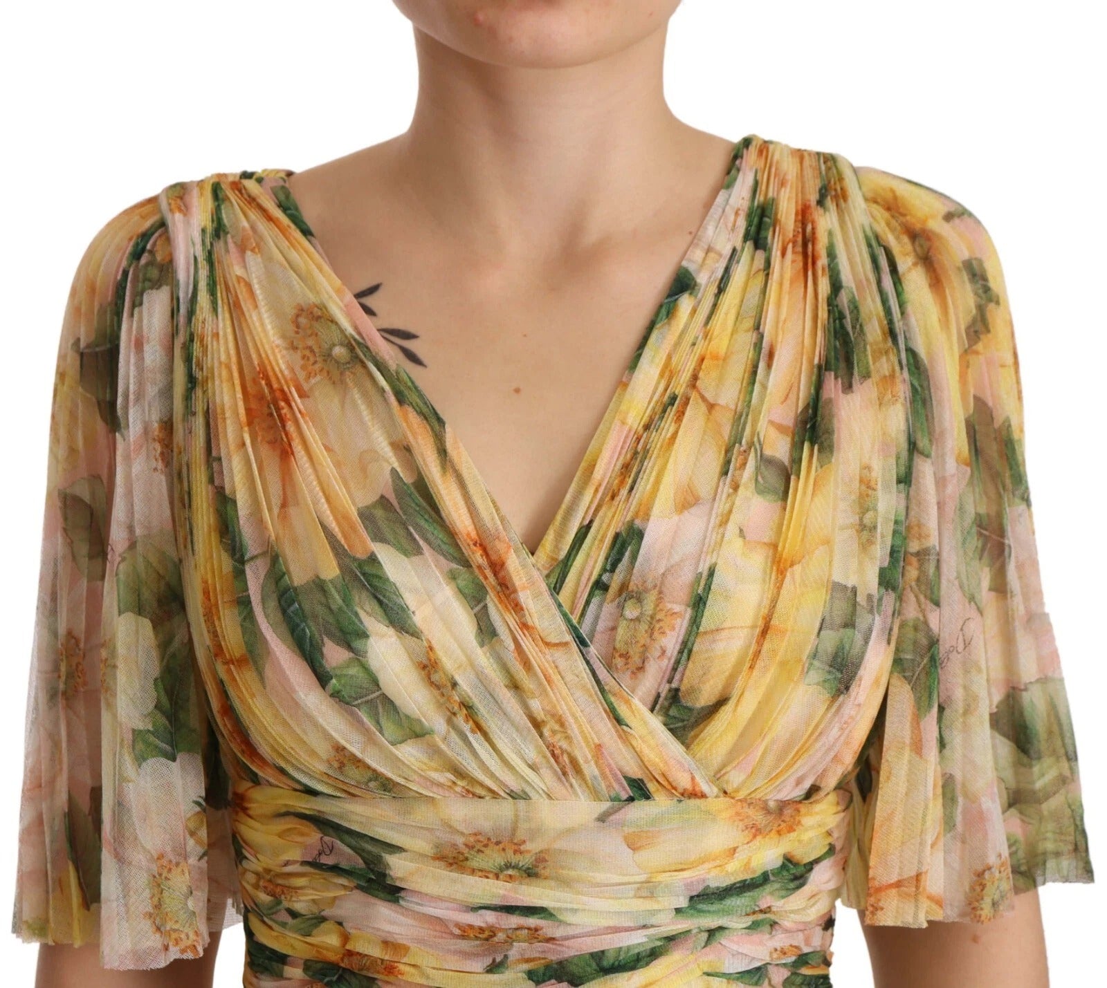 A yellow floral print pleated maxi dress with a V-neckline and short sleeves