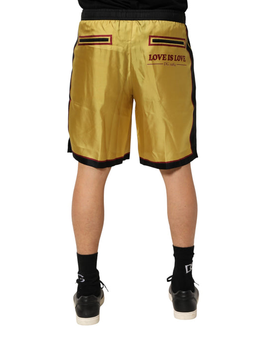 Pair of gold shorts with red trim and white lettering