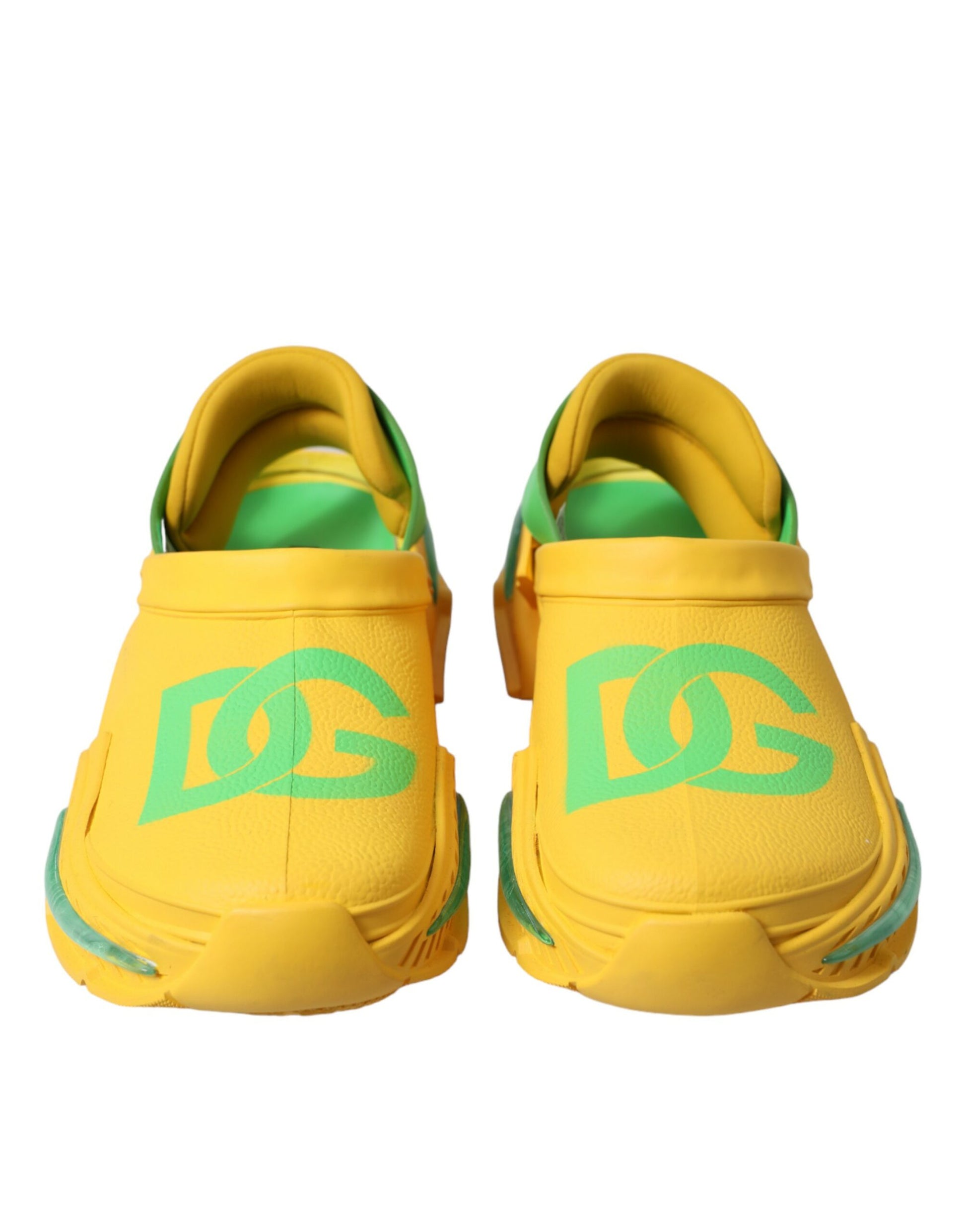 Pair of yellow and green sneakers with white laces