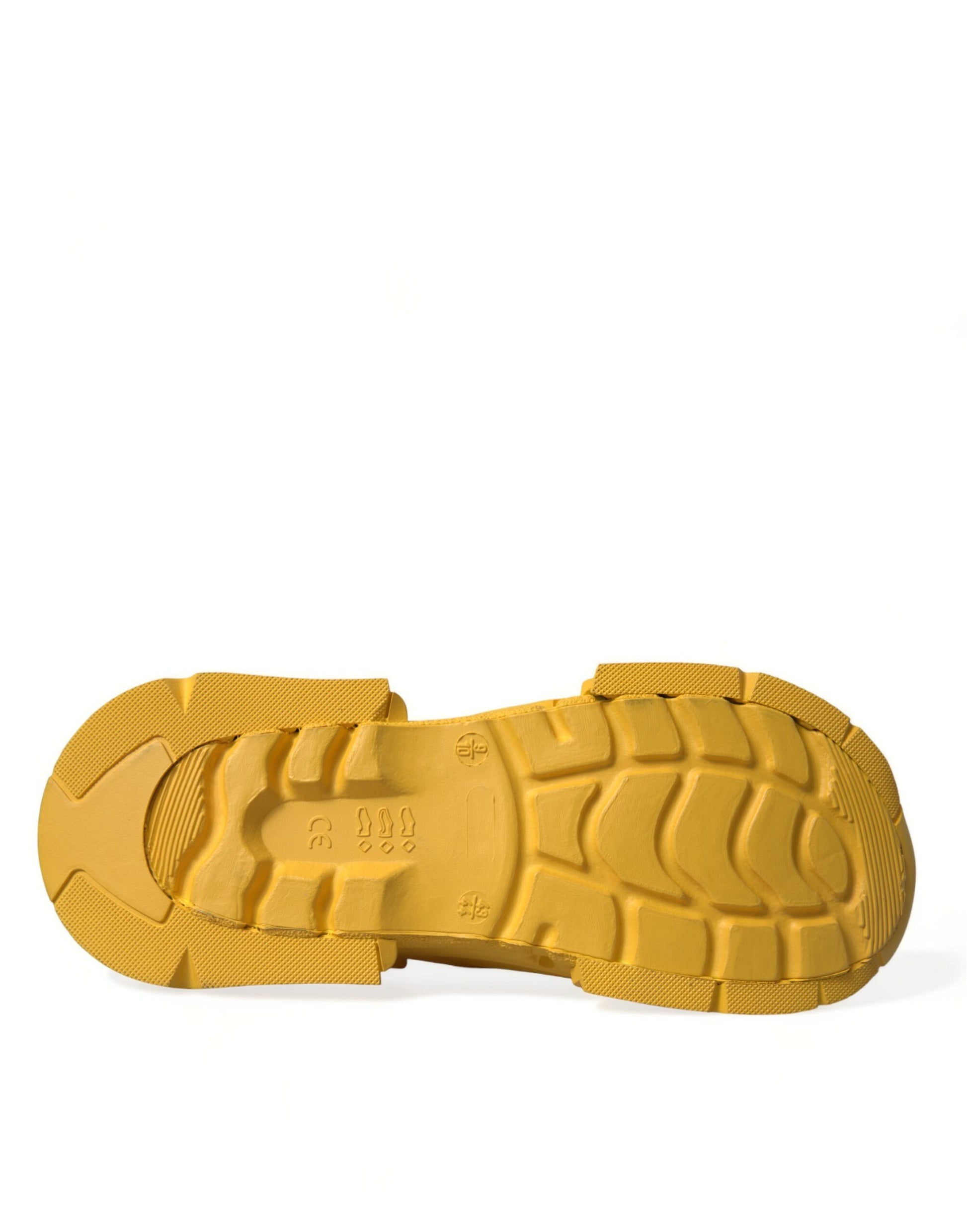 Yellow rubber shoe sole with treads and logo