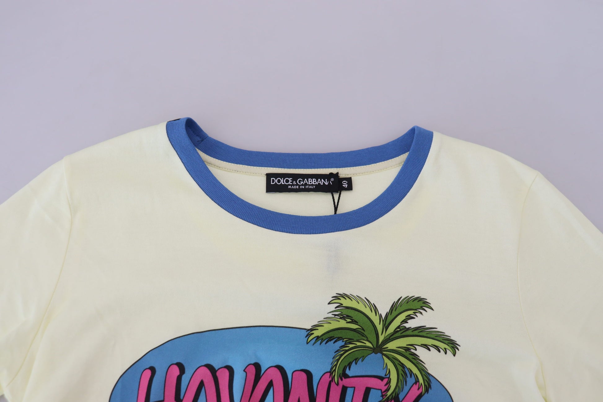 Yellow shirt with blue collar and palm tree graphic on front