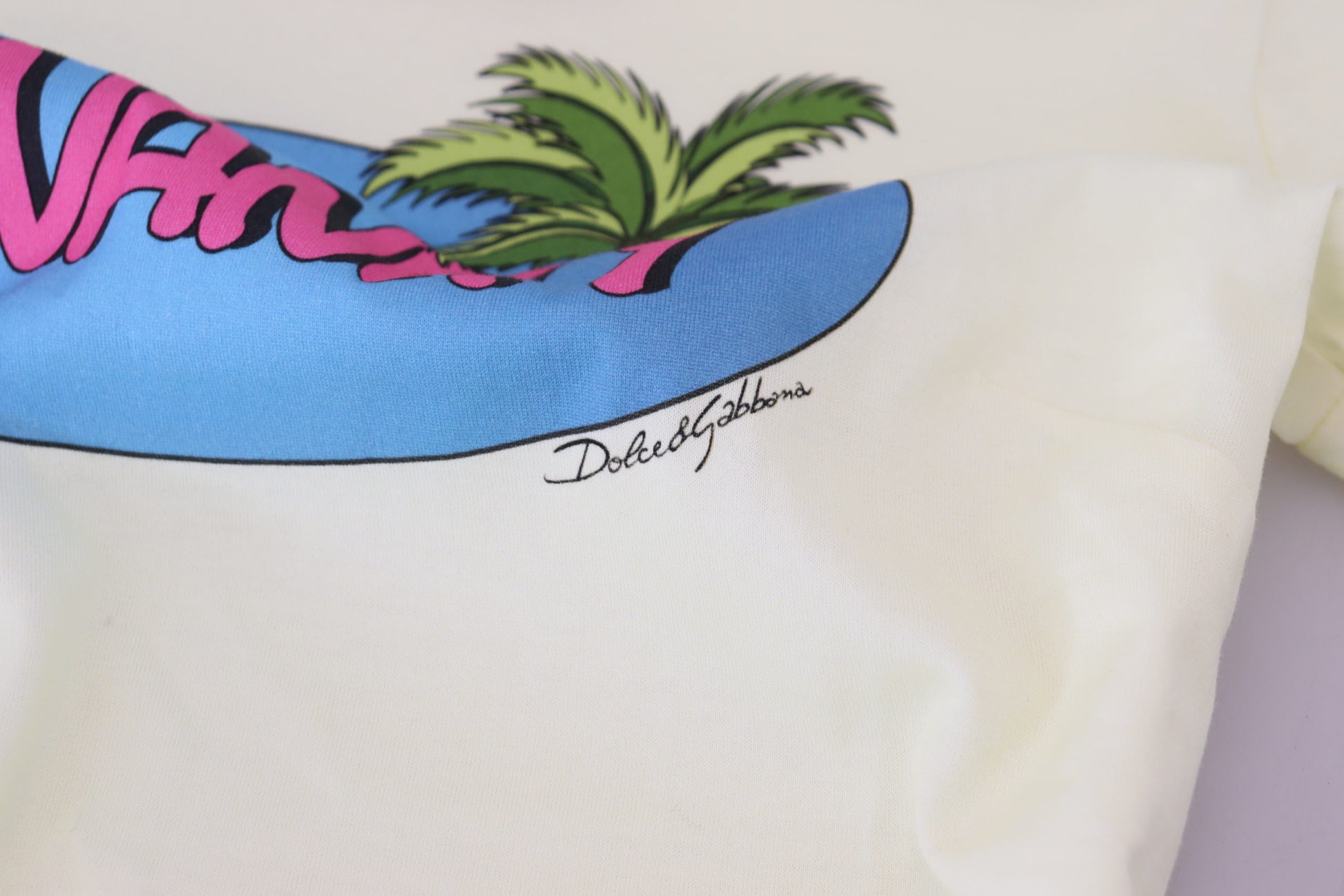 White t-shirt with blue palm tree graphic