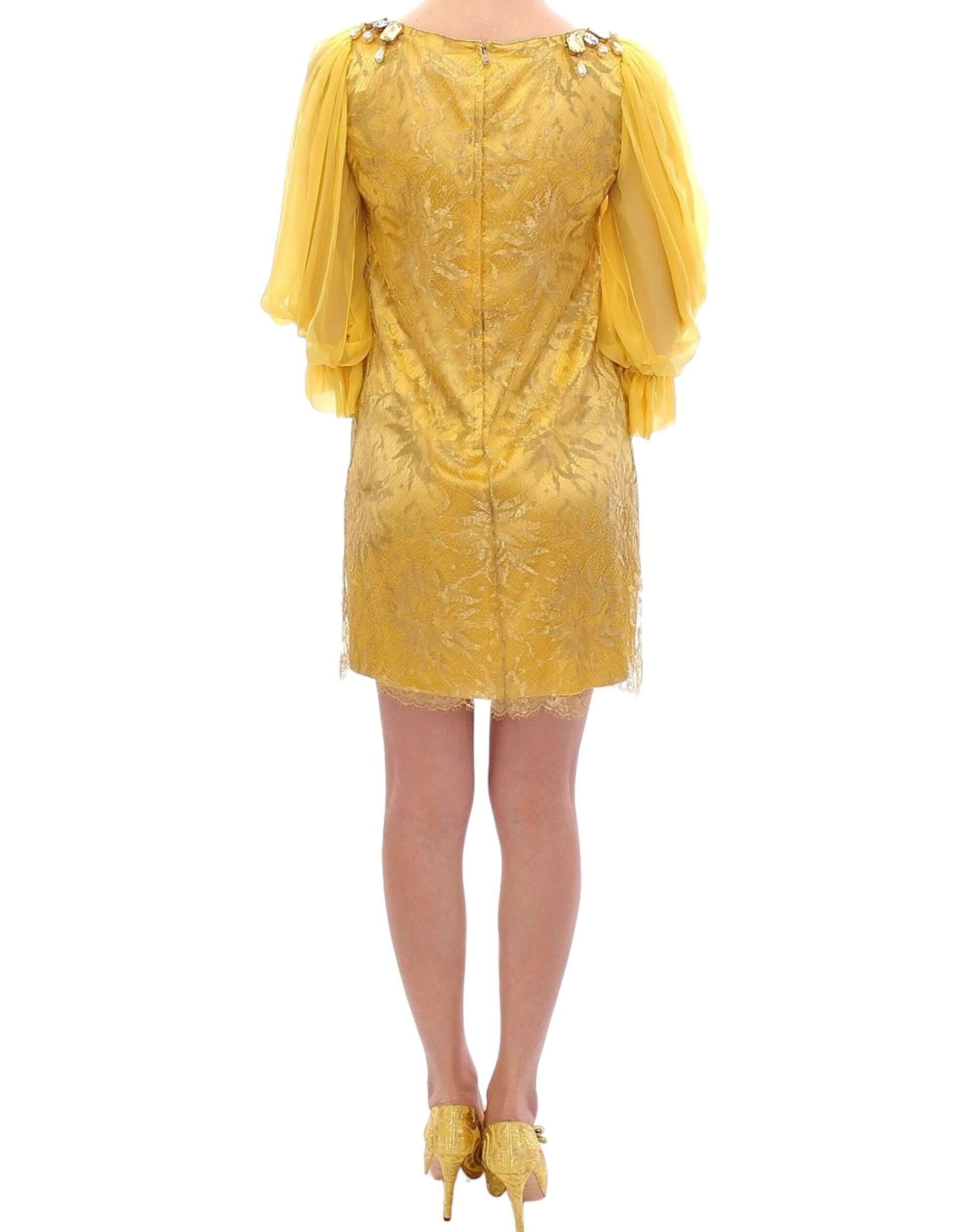 Yellow sequined dress with long sleeves and ruffled shoulders