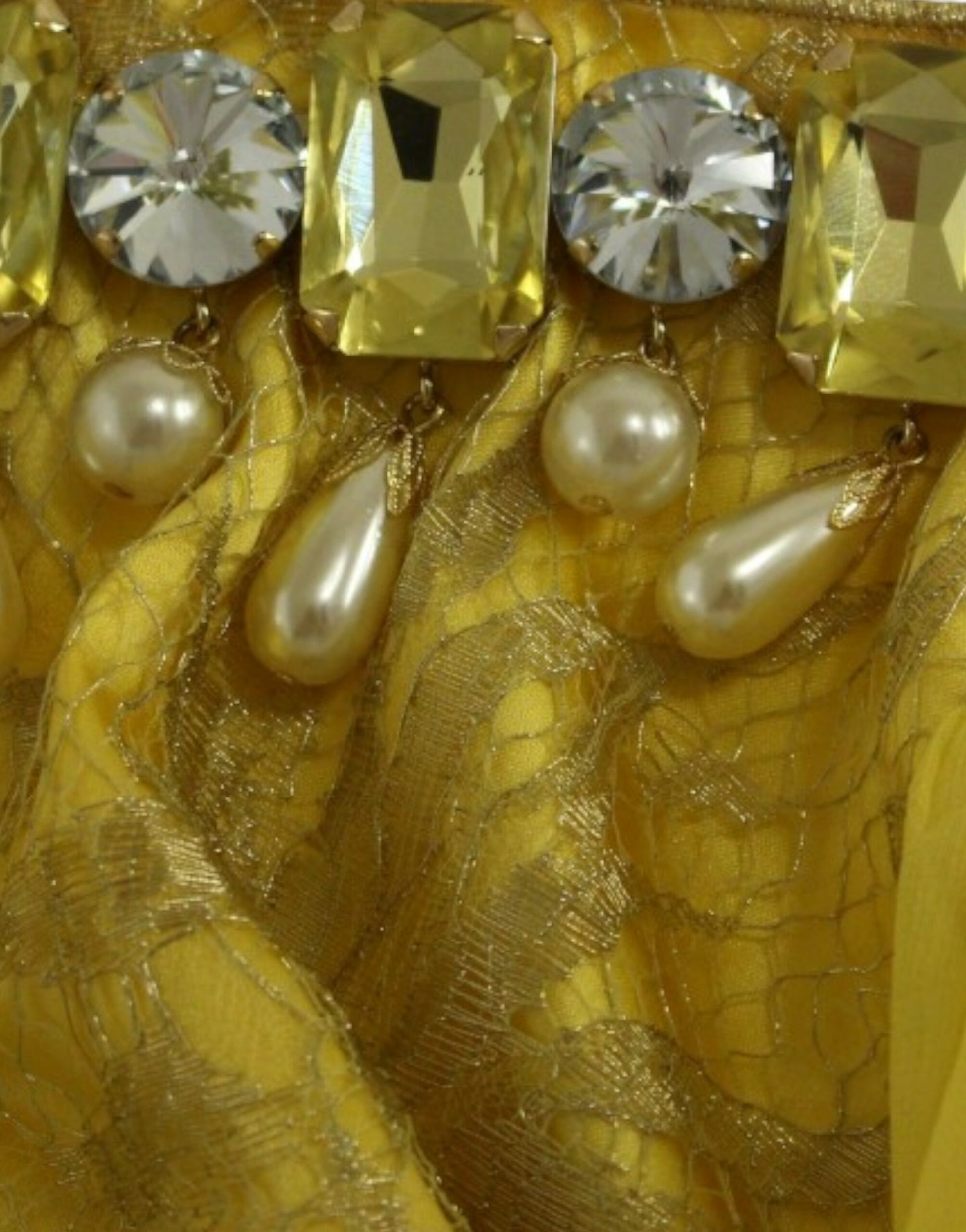 Yellow fabric with pearls and crystals