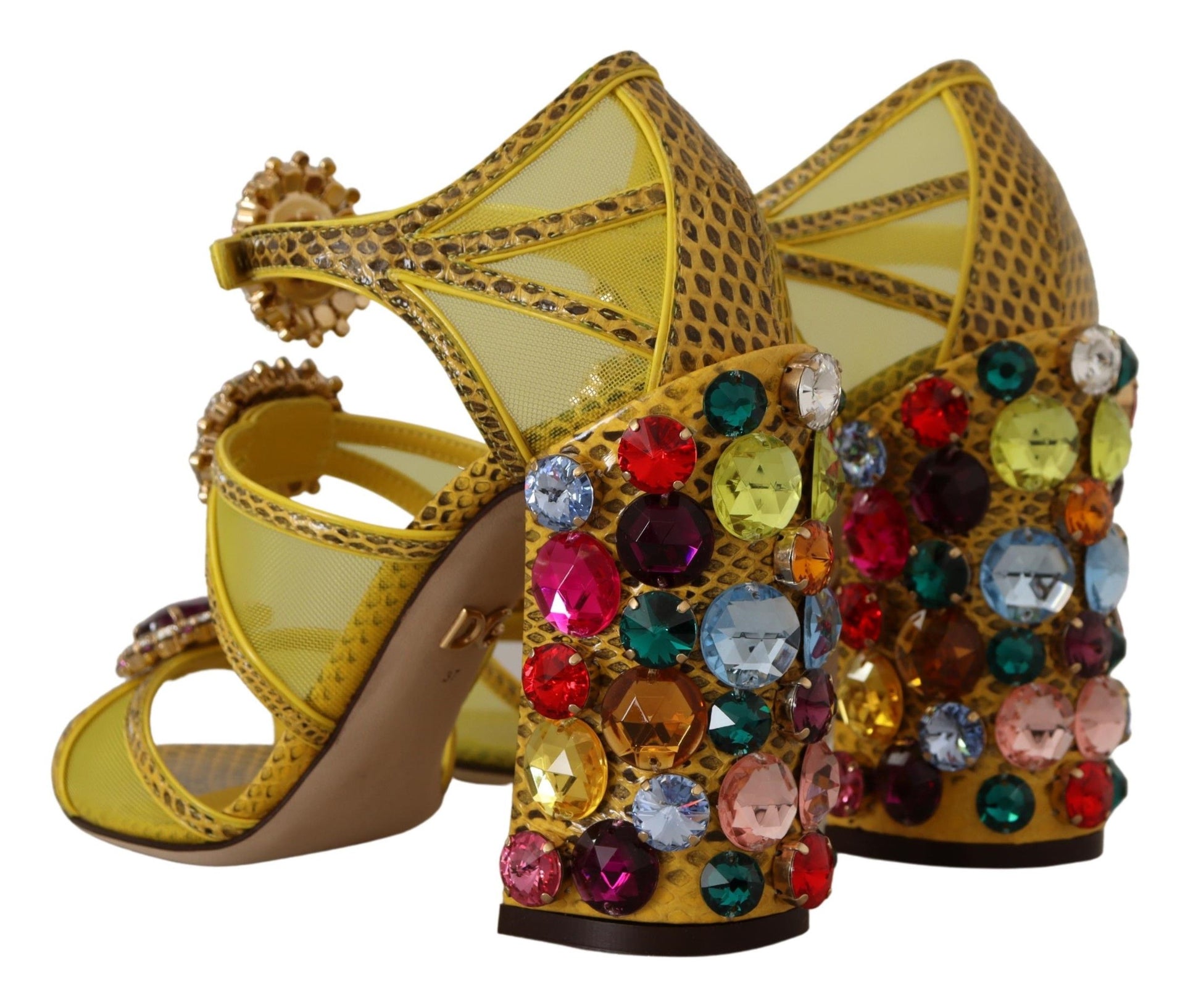 Yellow high heel shoes with rhinestones and a bow on top