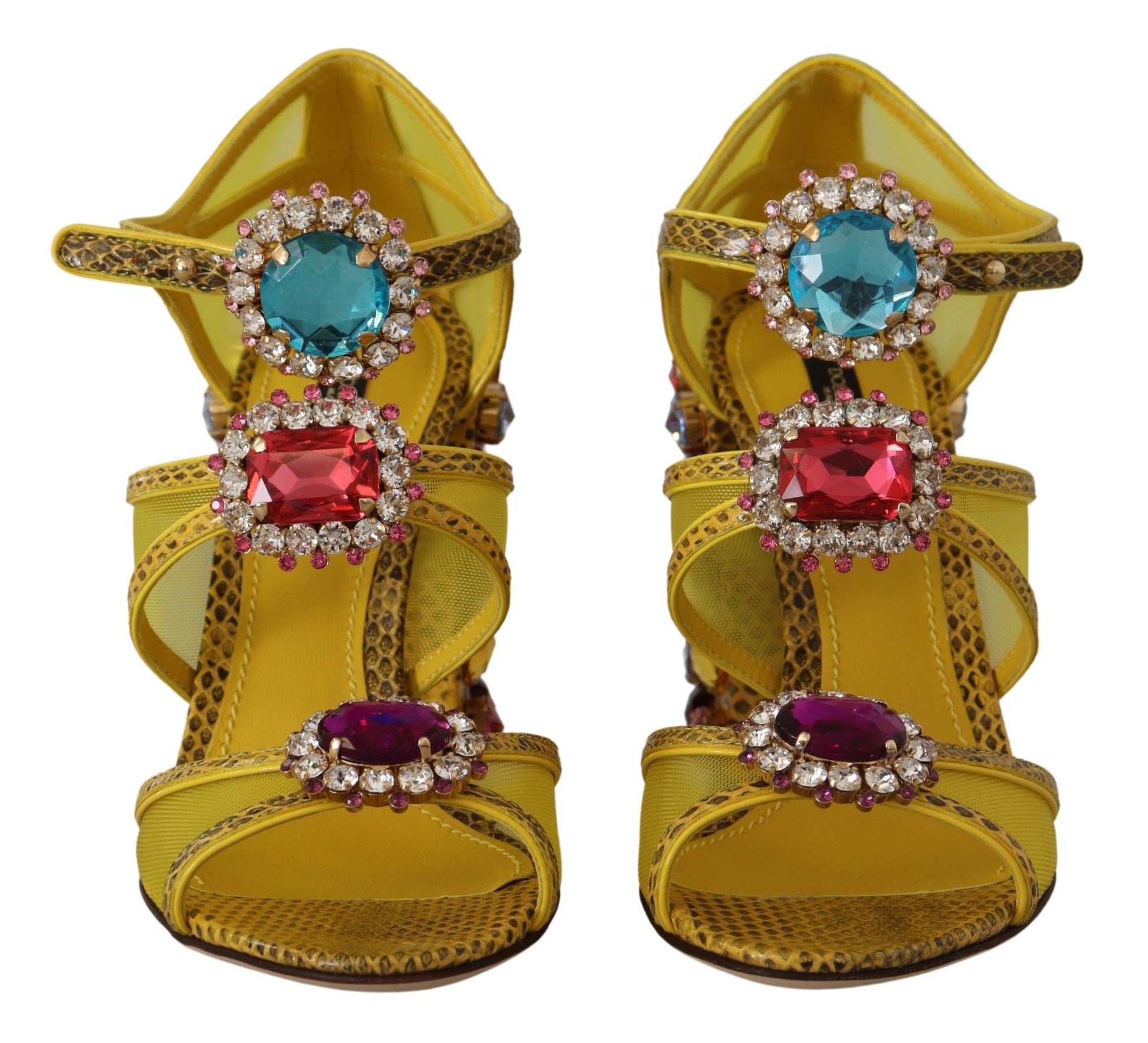 Pair of women's shoes with straps and embellishments featuring red, blue, and yellow gemstones