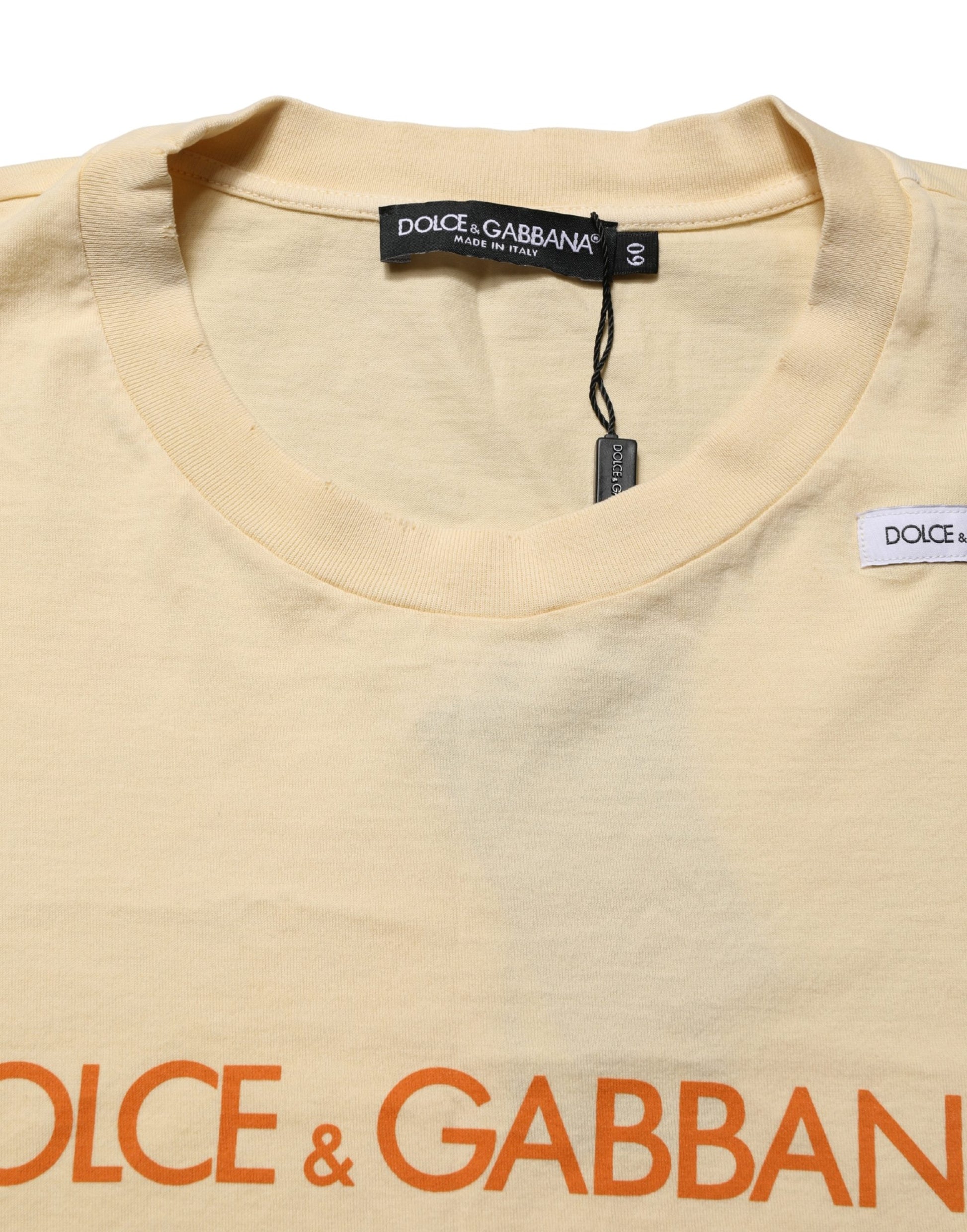 A yellow crew neck t-shirt with a logo print on the front