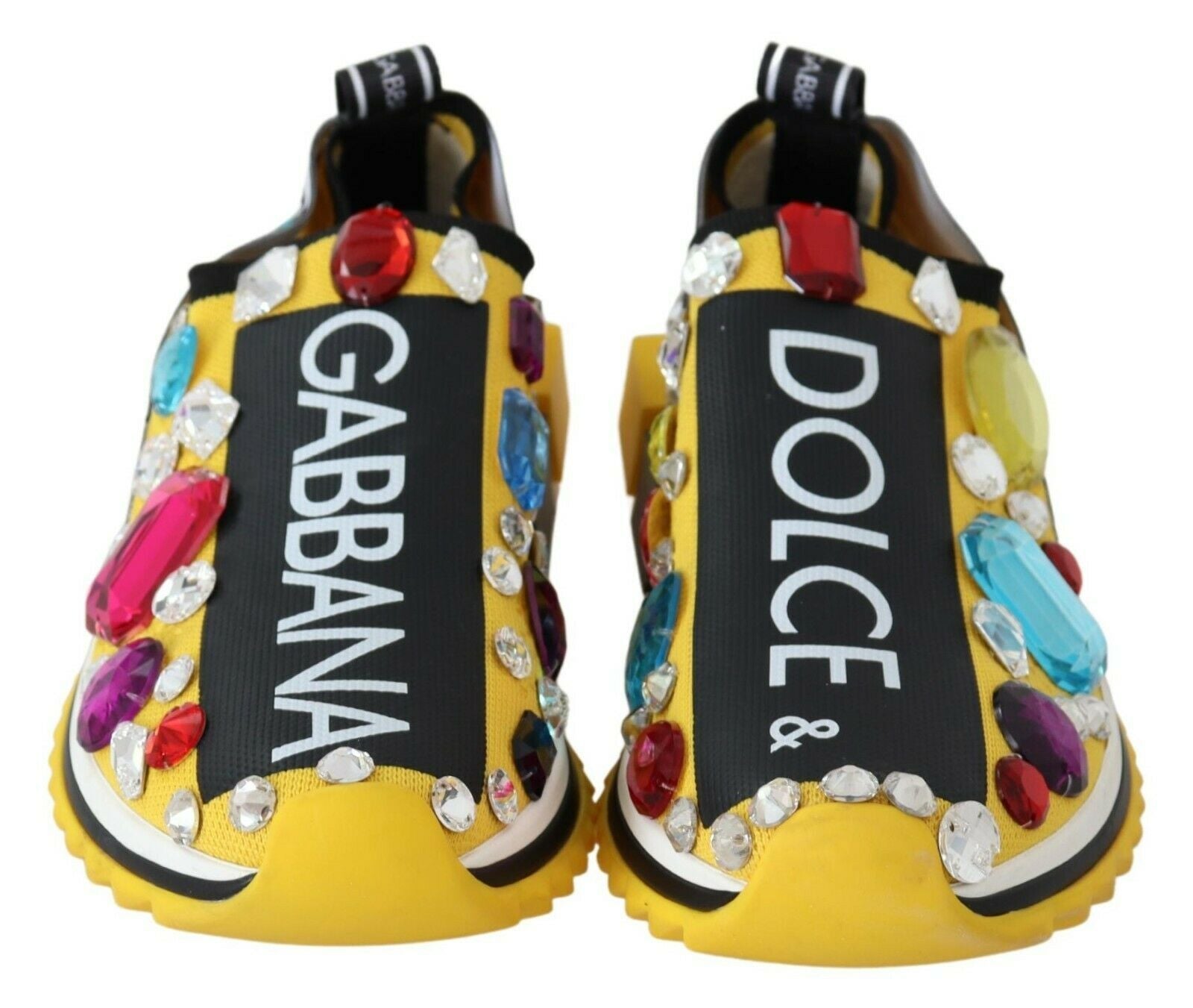 Yellow shoes with Gabanna Dolce & Gabbana written on them and decorated with multicolored gemstones