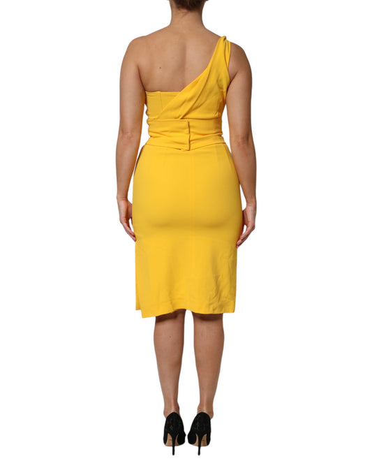 A yellow midi dress with a side slit and one shoulder, designed by Dolce & Gabbana