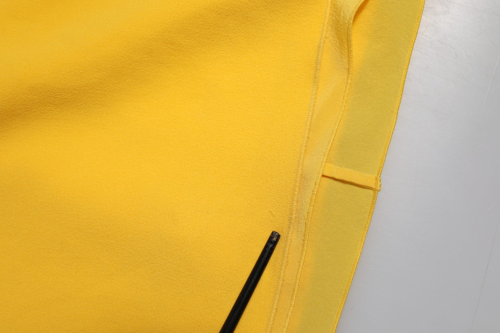 Yellow sports jersey with black trim