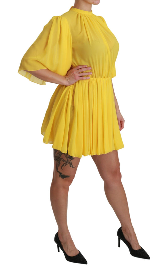 Yellow pleated mini dress with short sleeves and high neckline