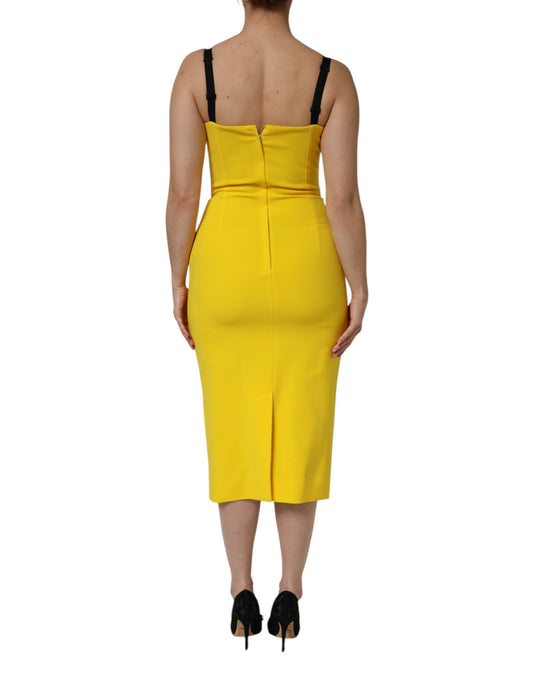 A sleeveless yellow midi dress with a fitted silhouette and a sheath style