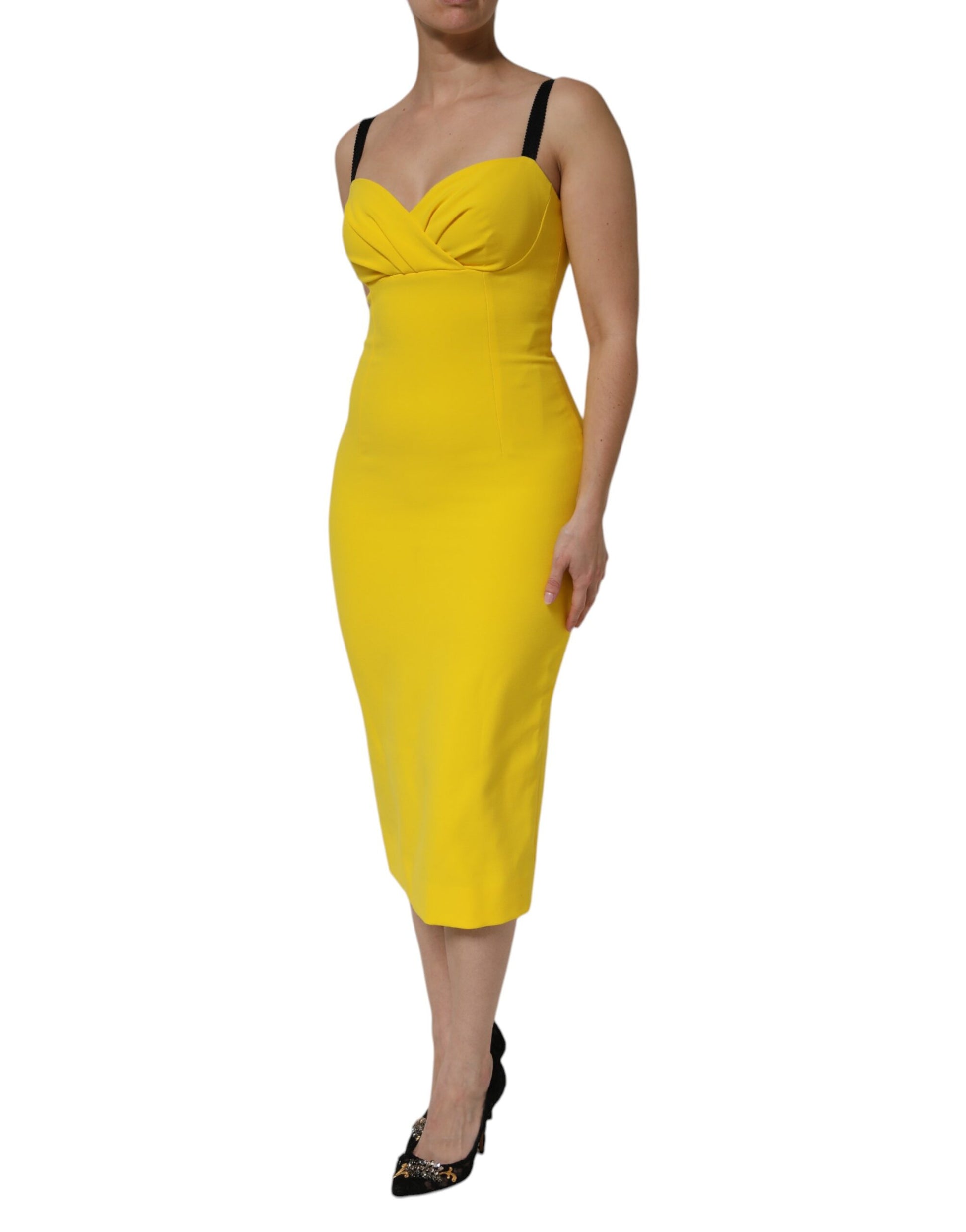 A yellow sleeveless sheath midi dress with a fitted silhouette