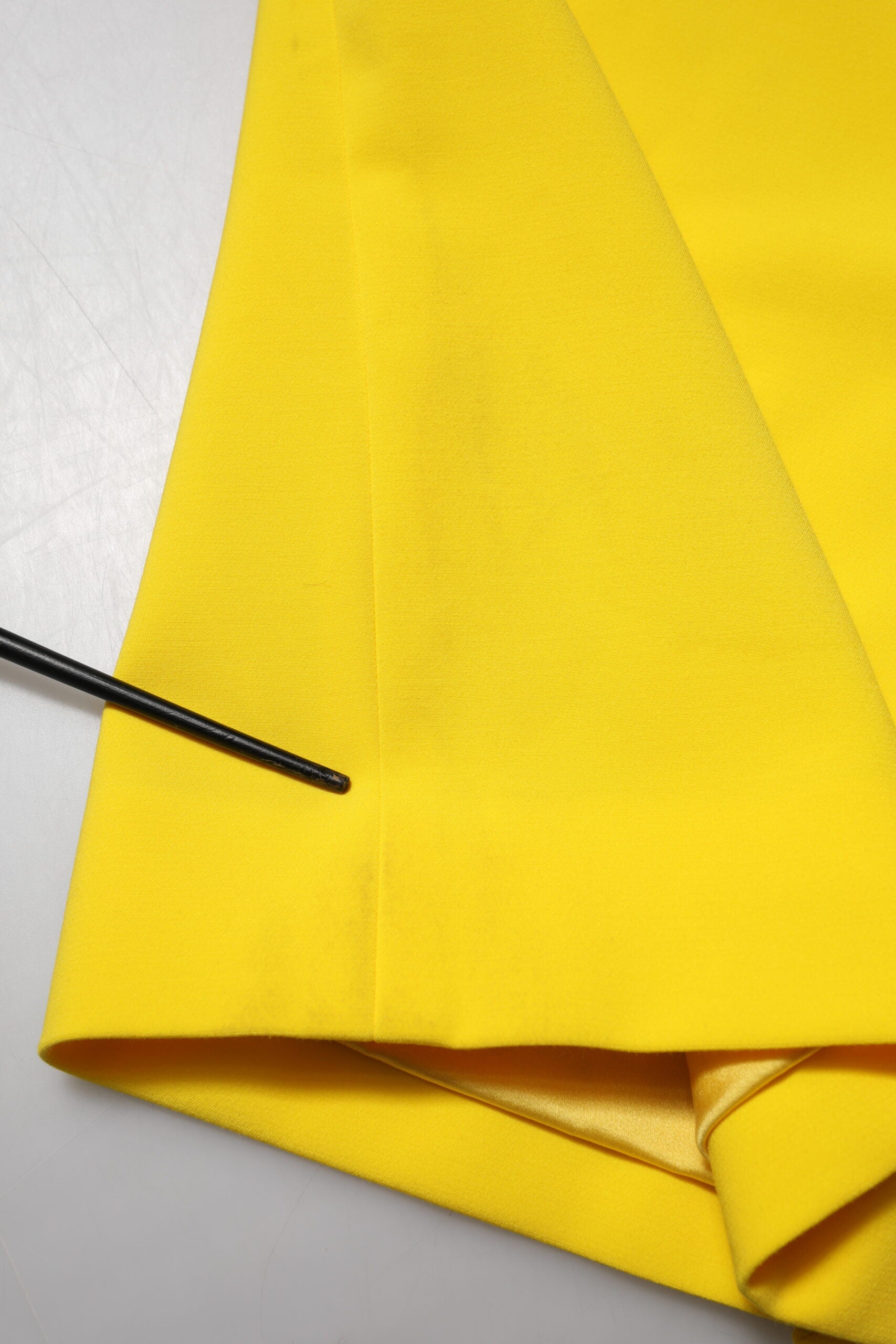 A yellow sleeveless sheath midi dress by Dolce & Gabbana
