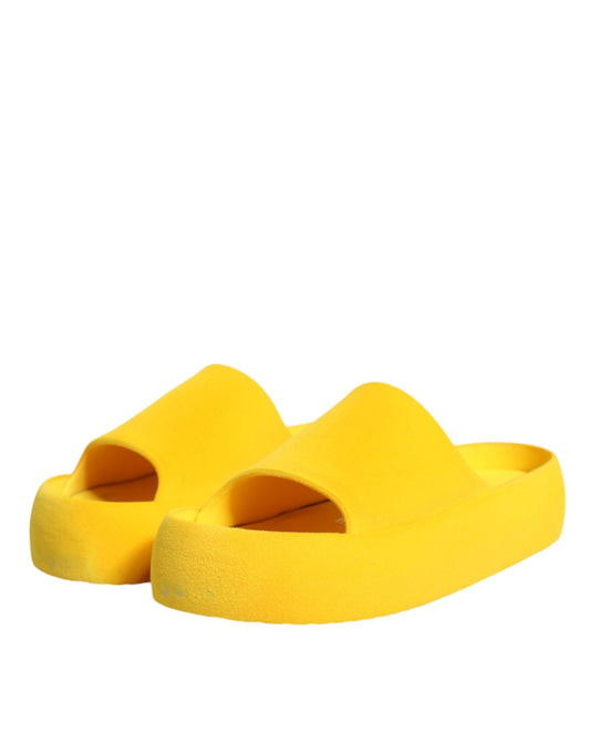 Yellow flip flops on white background