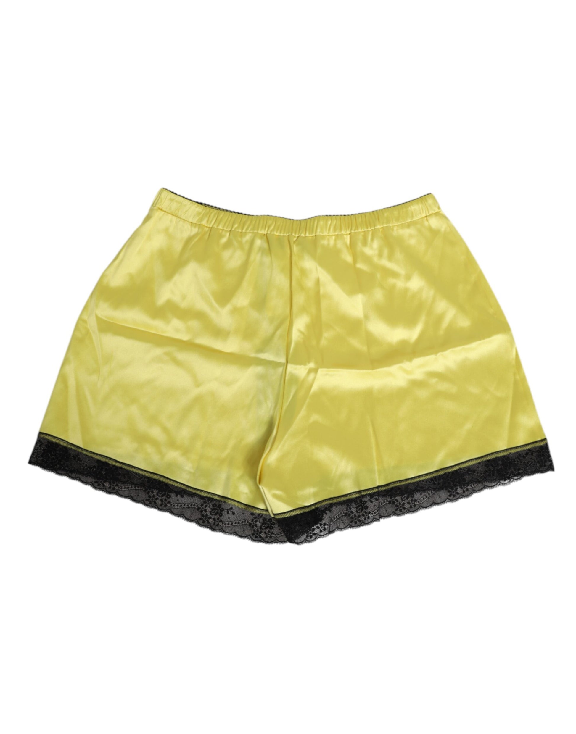 A pair of yellow satin silk mid waist underwear shorts