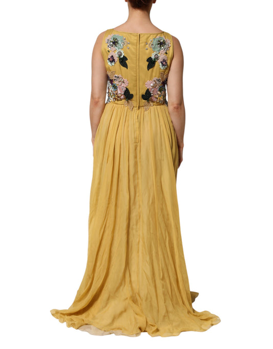 A long yellow silk dress with floral embroidery on the back and sleeves
