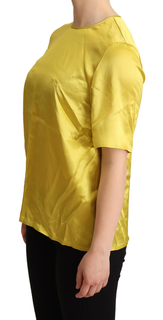 Yellow sleeveless top on a woman