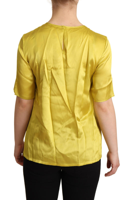 Yellow sleeveless top on a person