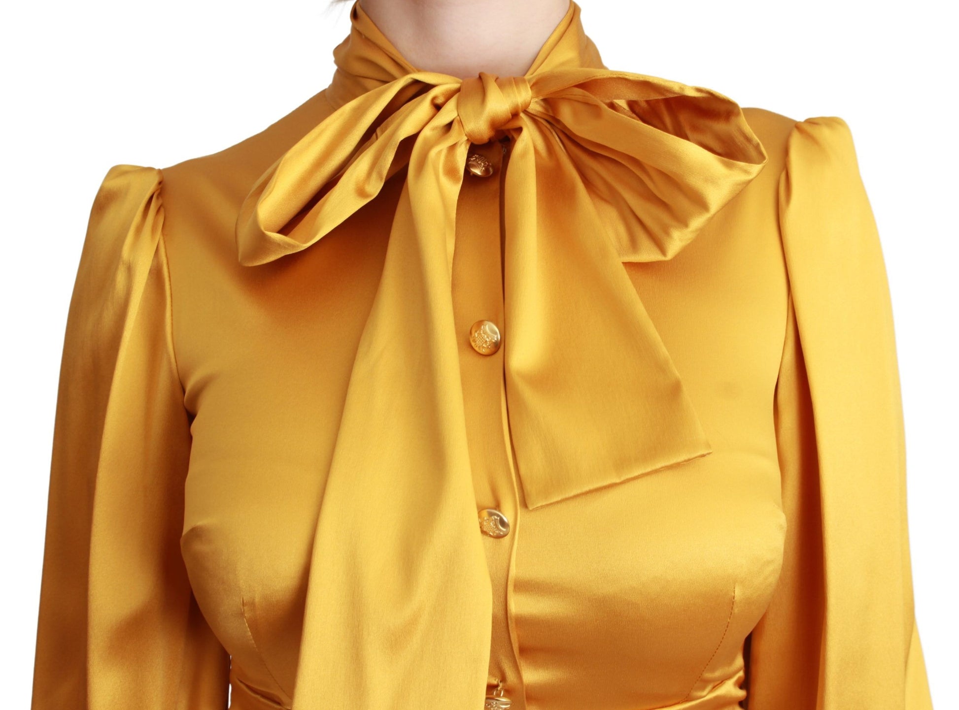 A yellow silk stretch sheath bodycon mini dress with a bow tie neckline