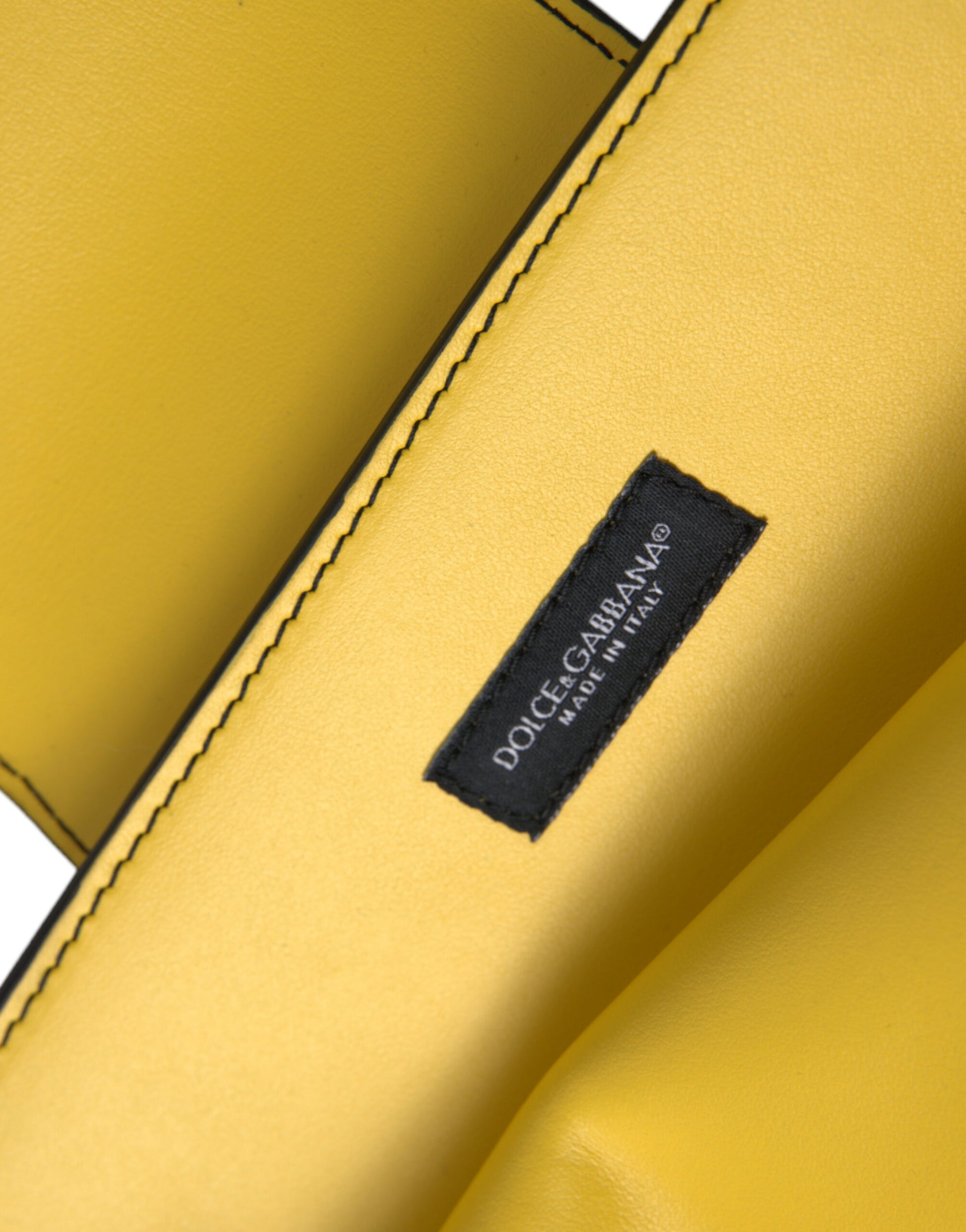 Yellow leather wallet with black label