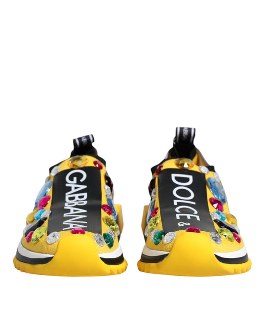 Pair of yellow sneakers with crystal embellishments and a black label