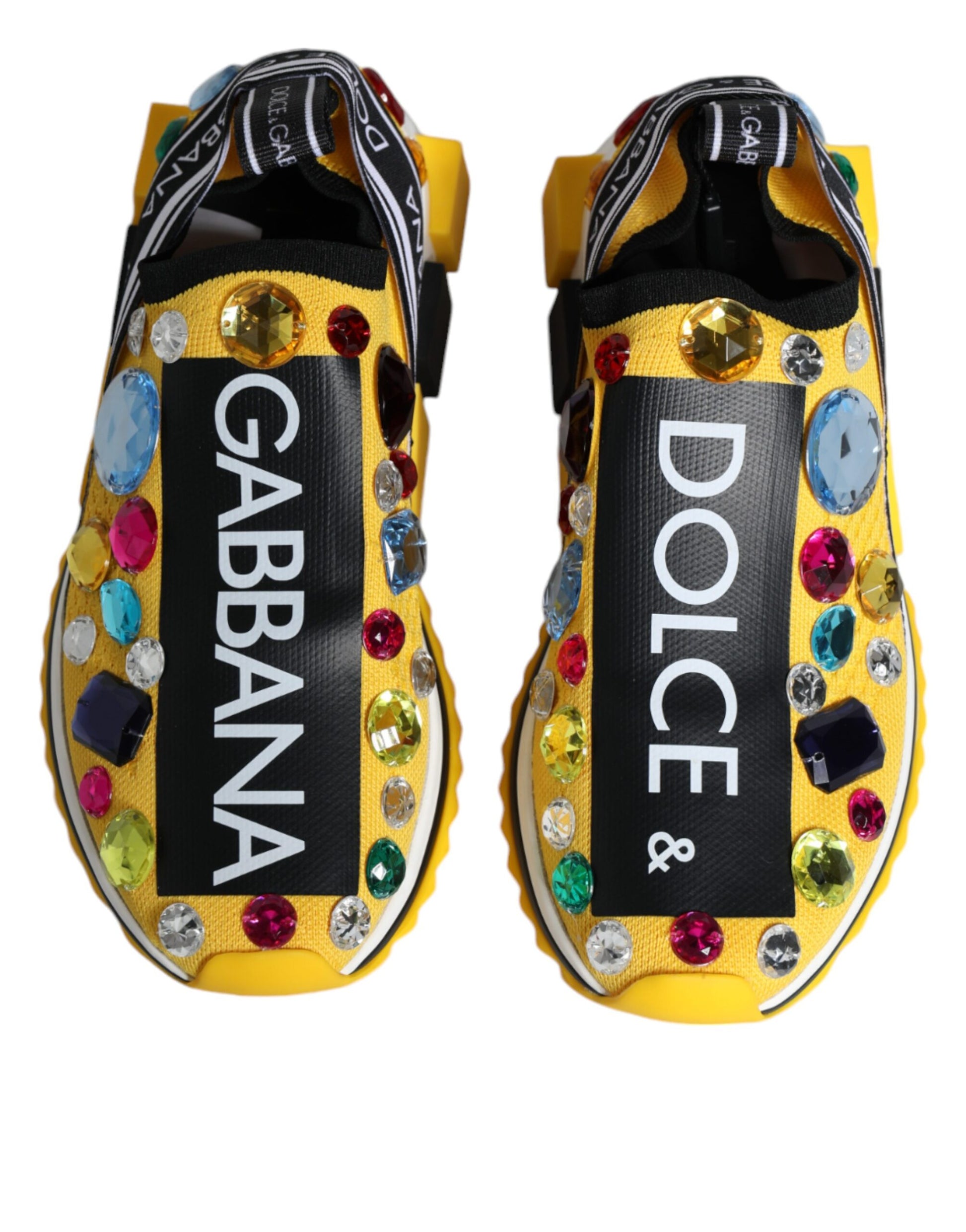 Pair of yellow sneakers with crystal embellishments, featuring the names "Dolce & Gabbana" and "Sorrento"