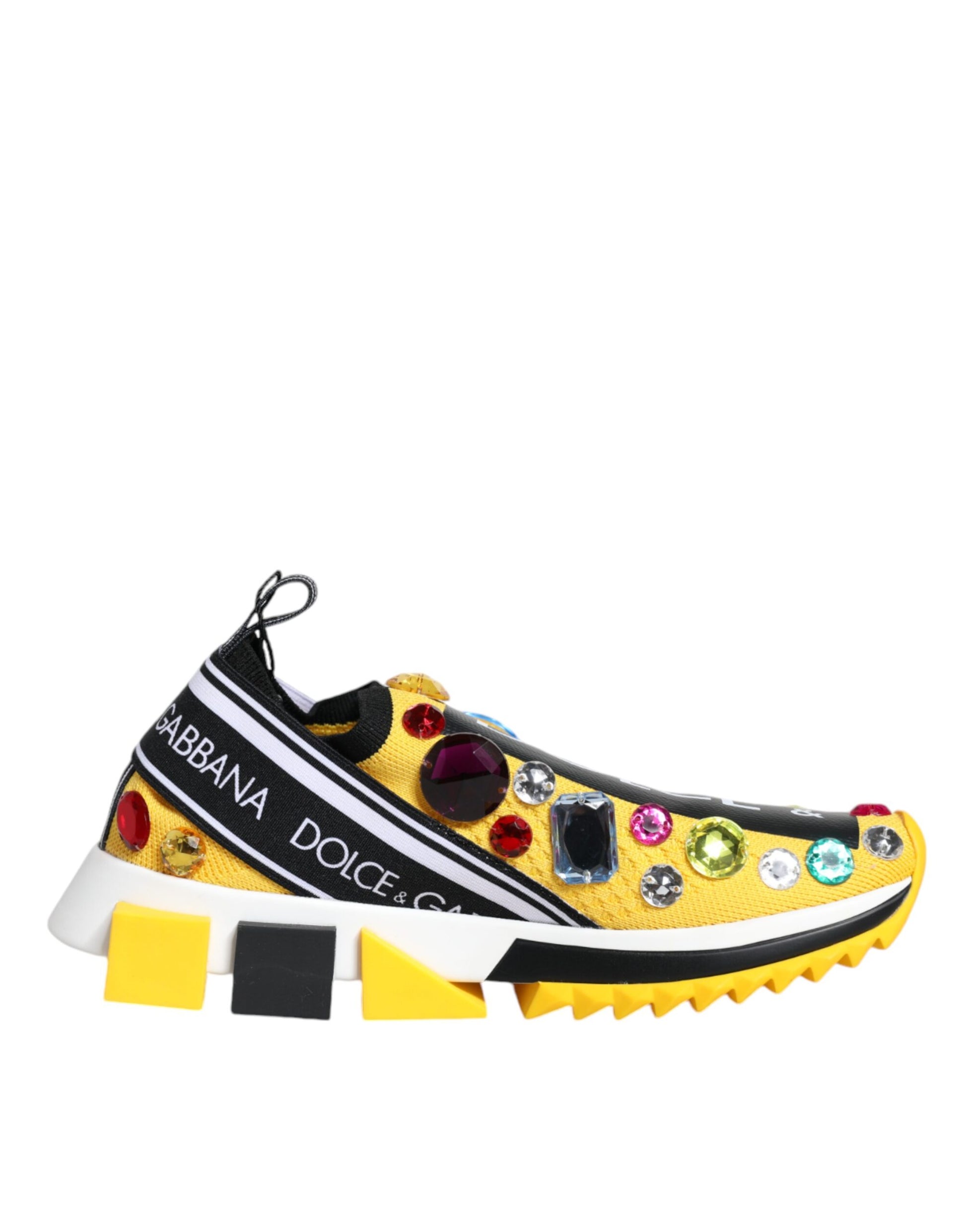 A pair of yellow sneakers with crystal embellishments and a black stripe