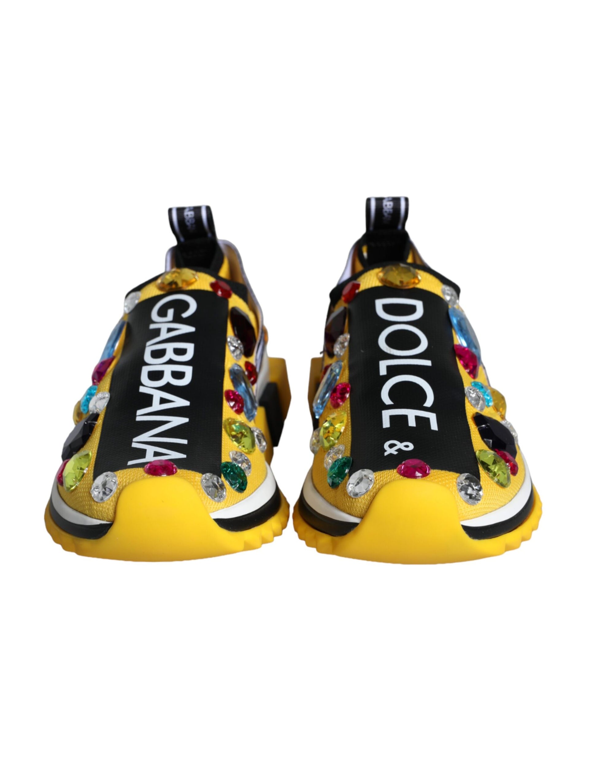 Pair of yellow high heel shoes with glittery embellishments and a label that reads GABANNA DOLCE & GABBANA