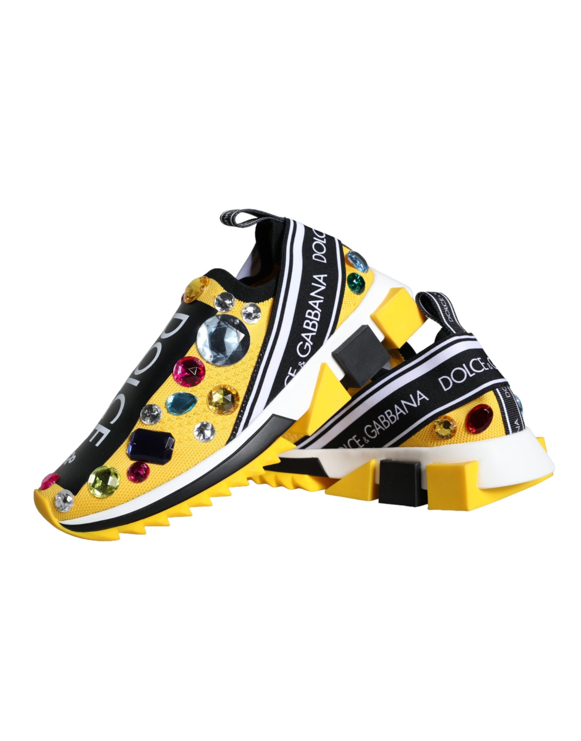 Yellow and white sneakers with colorful embellishments on soles