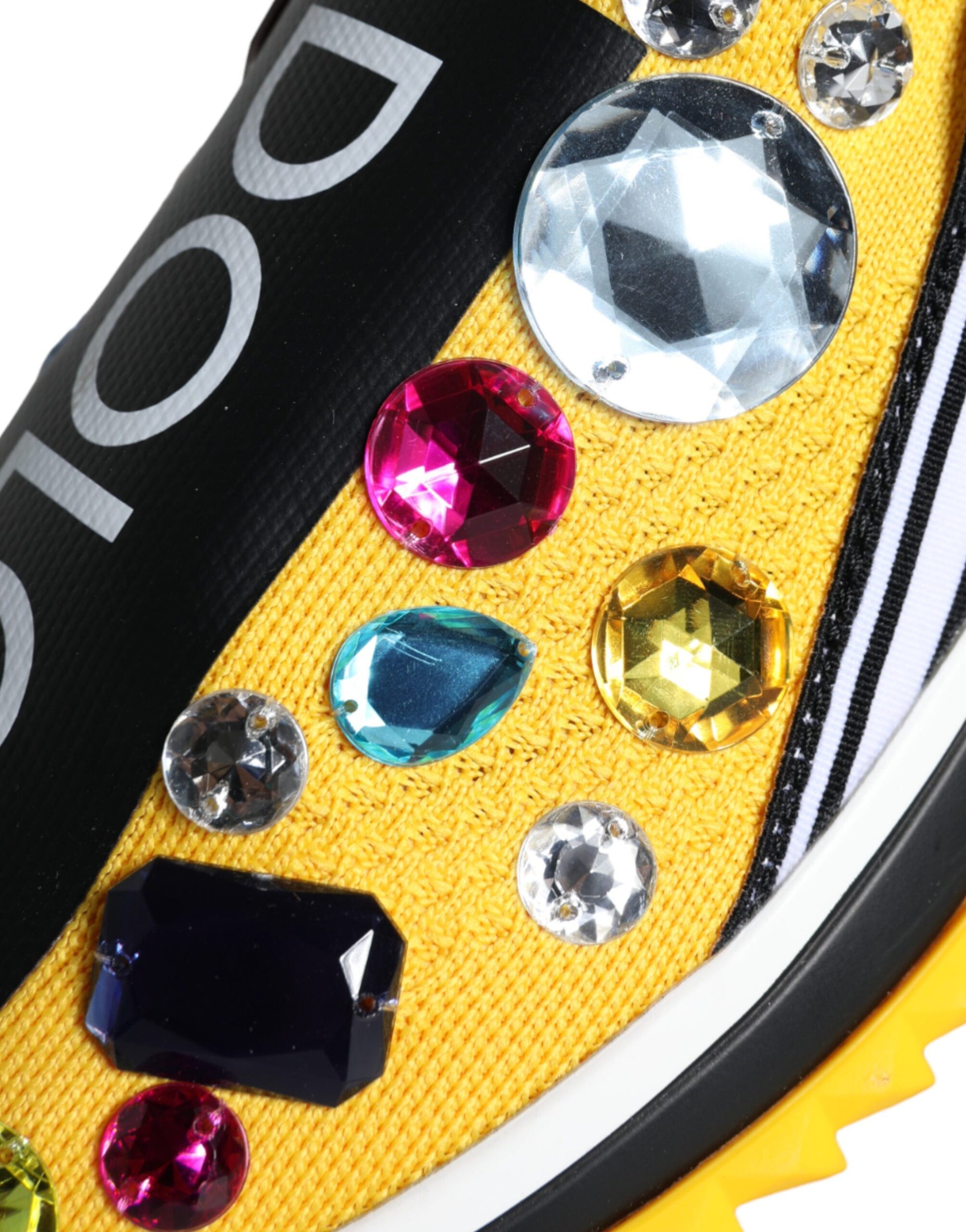 Yellow and black shoe with sparkling jewels on top