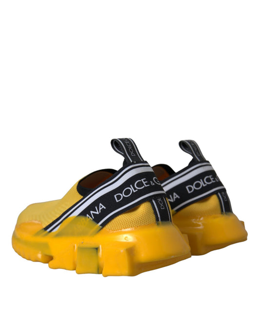Yellow children's shoes with black straps and a logo on the side