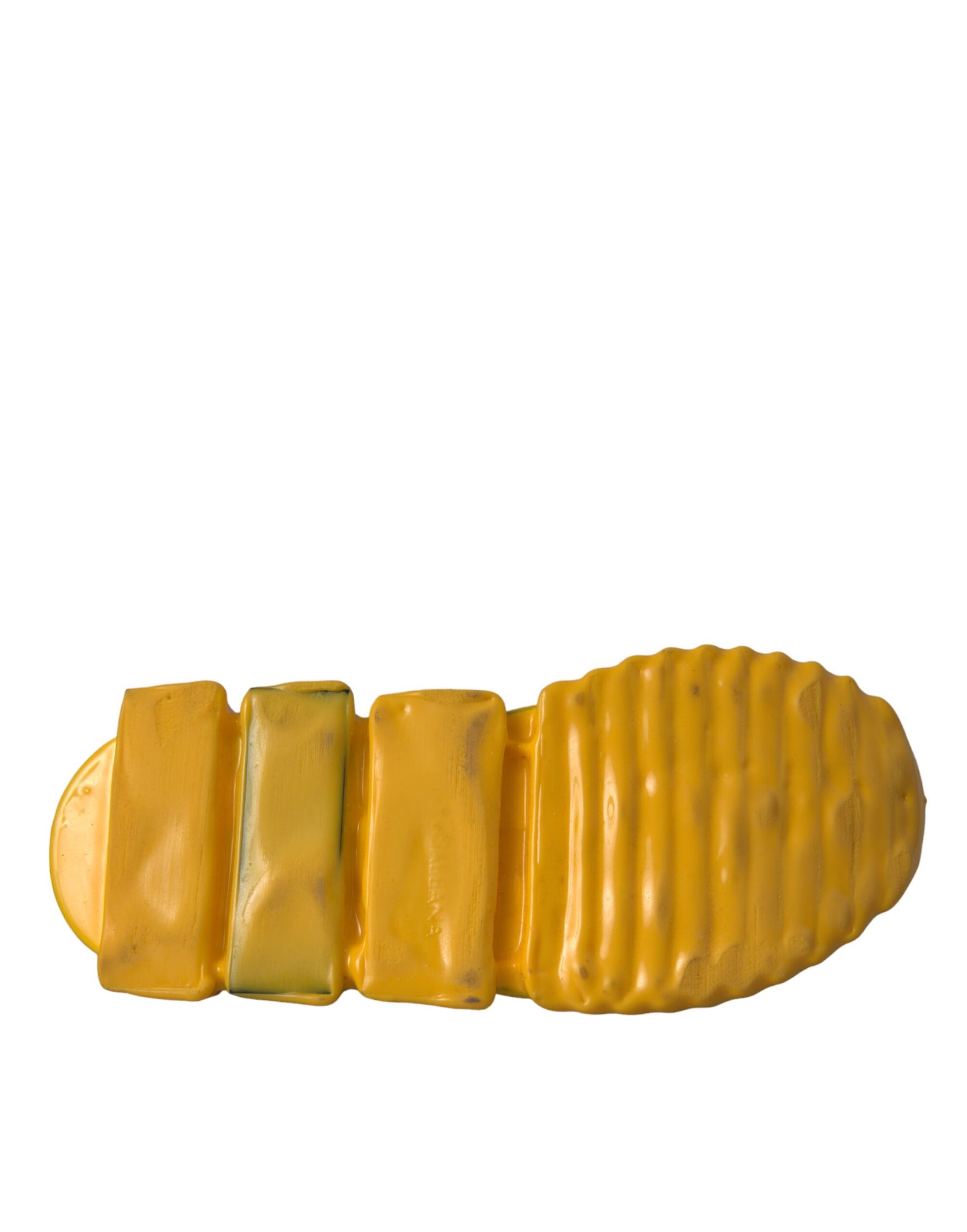 Yellow plastic shoe with a gold buckle