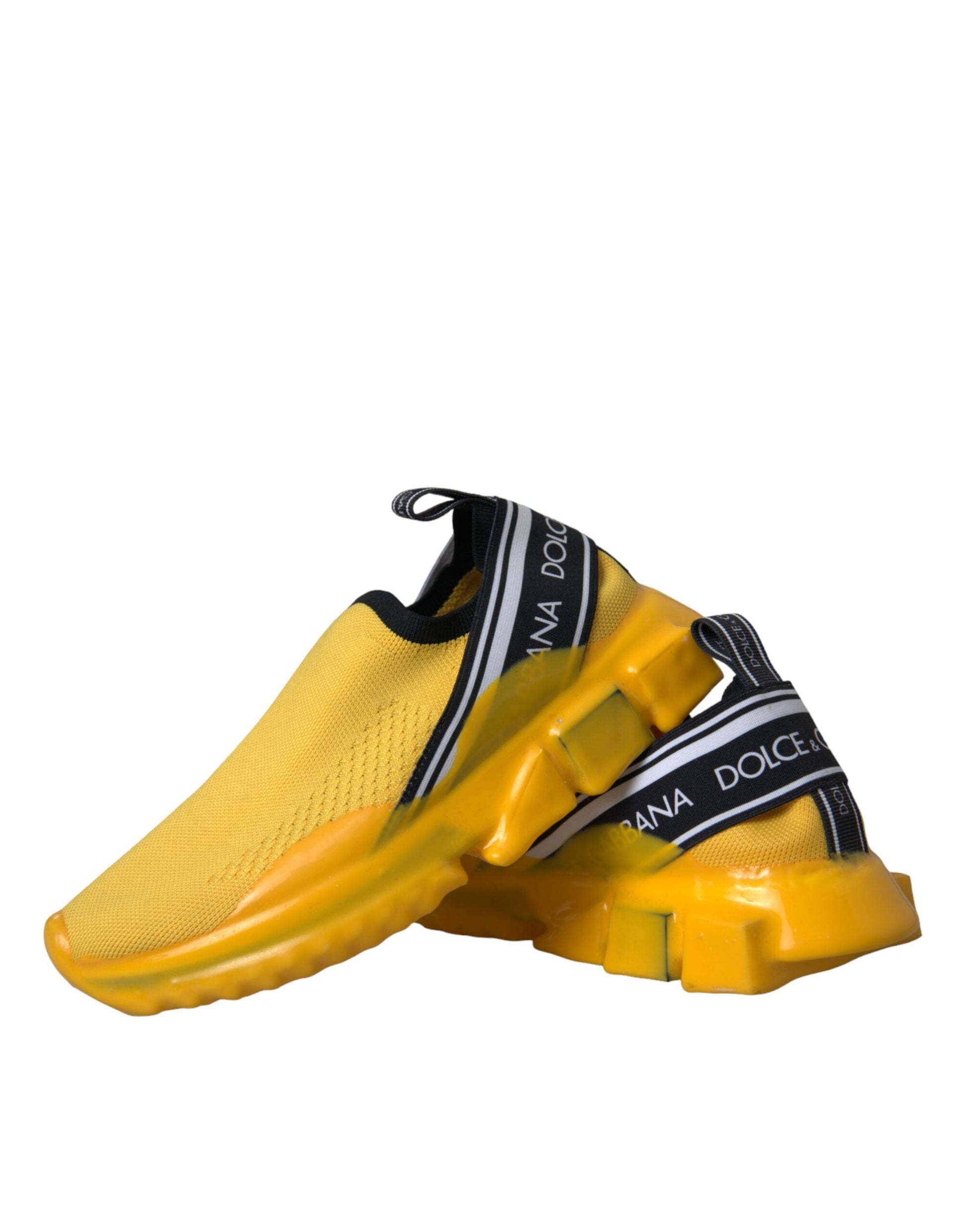 Yellow sneakers with black laces and a white logo on the side