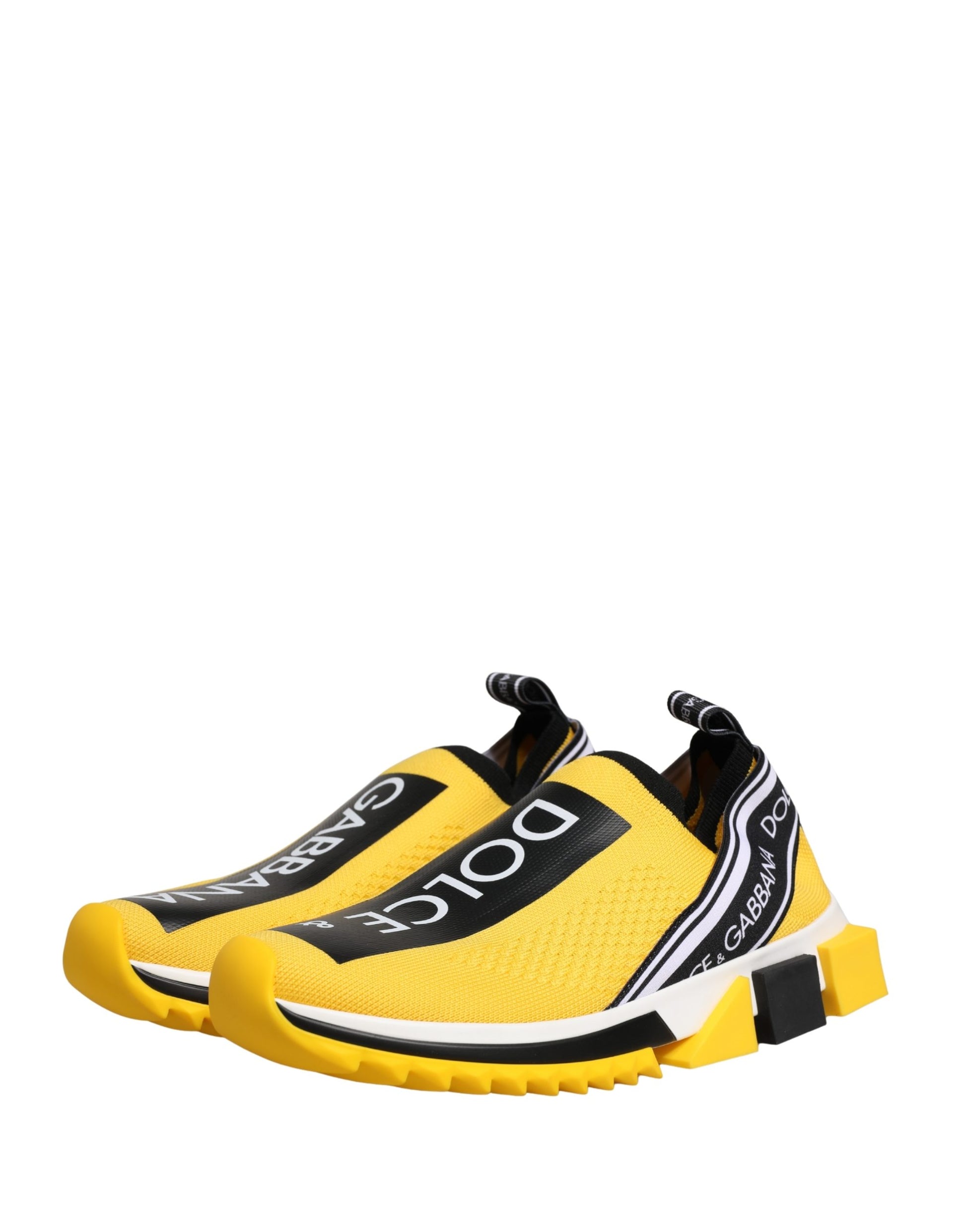 Yellow slip-on shoes with white and black accents, featuring the Dolce & Gabbana logo