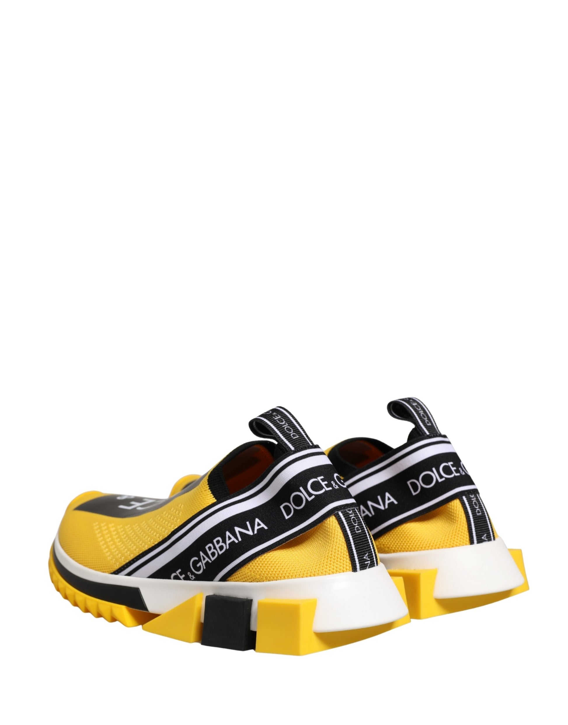 Yellow slip-on shoes with black and white stripes, featuring the Dolce & Gabbana logo