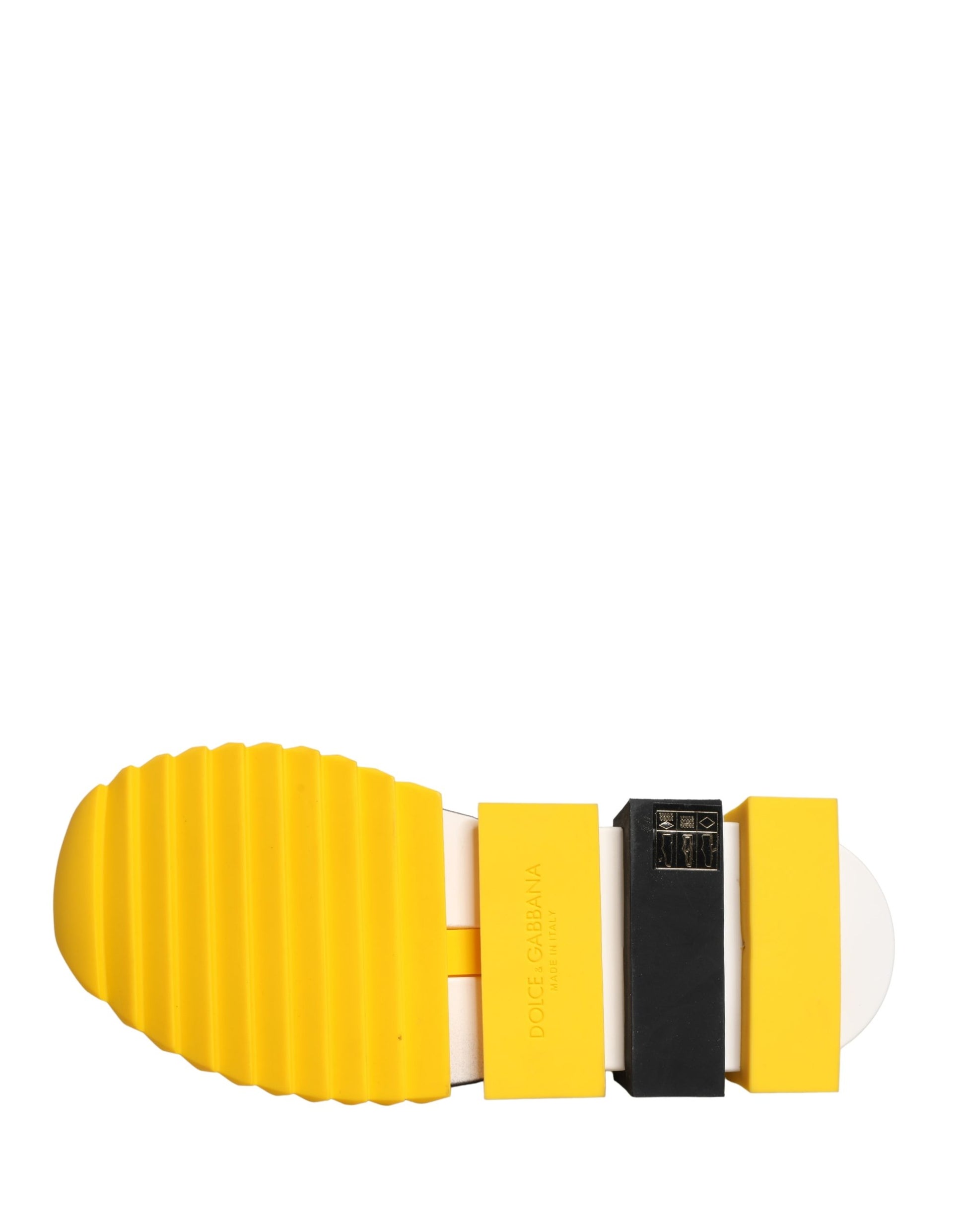 A pair of yellow and black slip-on shoes with a strap