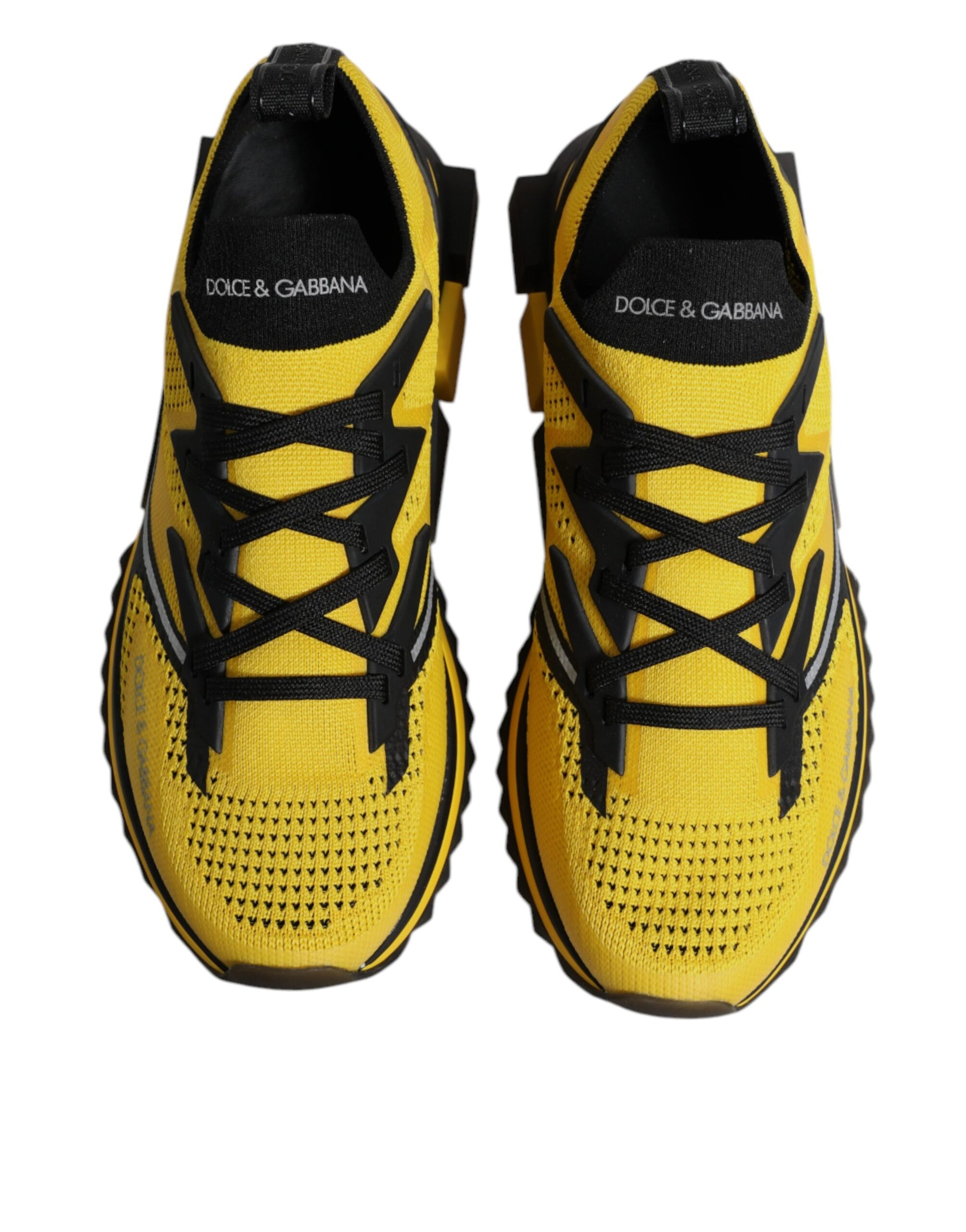 Pair of yellow and black athletic shoes with laces