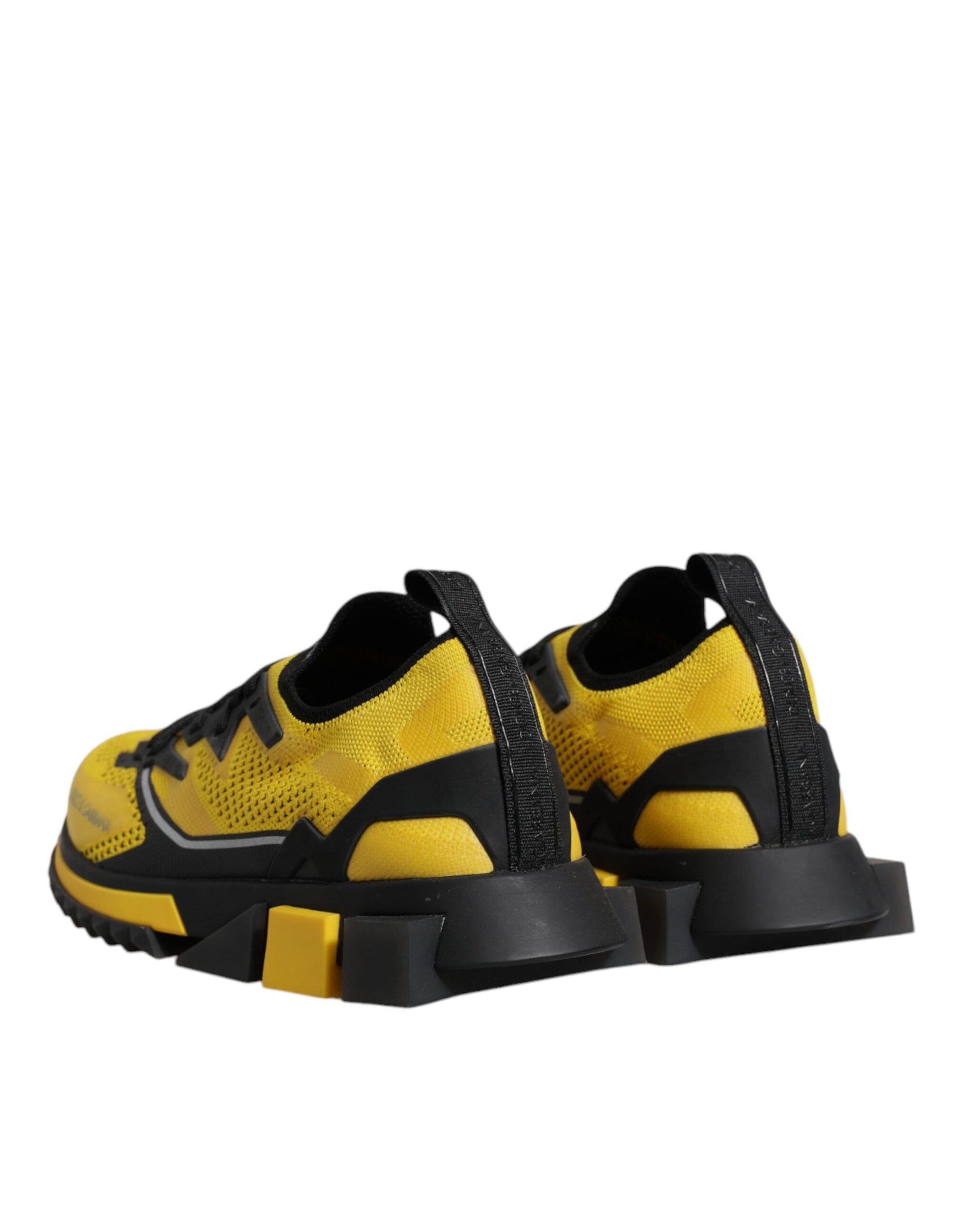 Yellow and black athletic shoes with laces