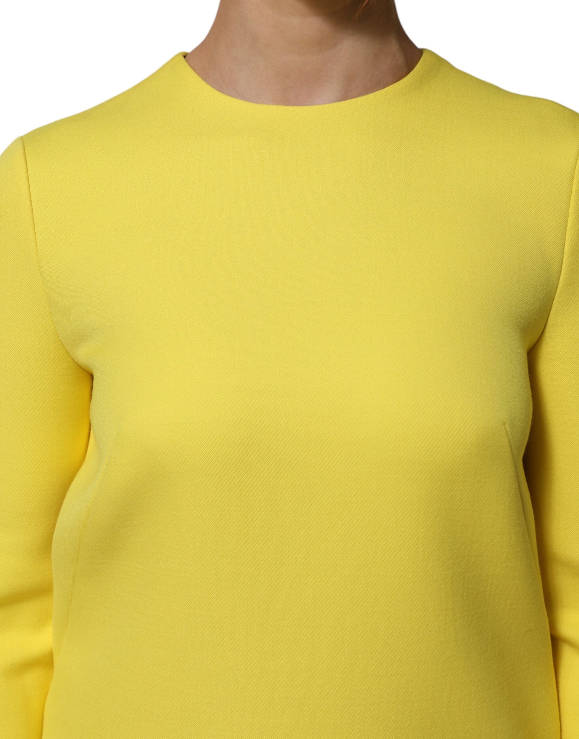 A yellow viscose acetate mini long sleeve dress