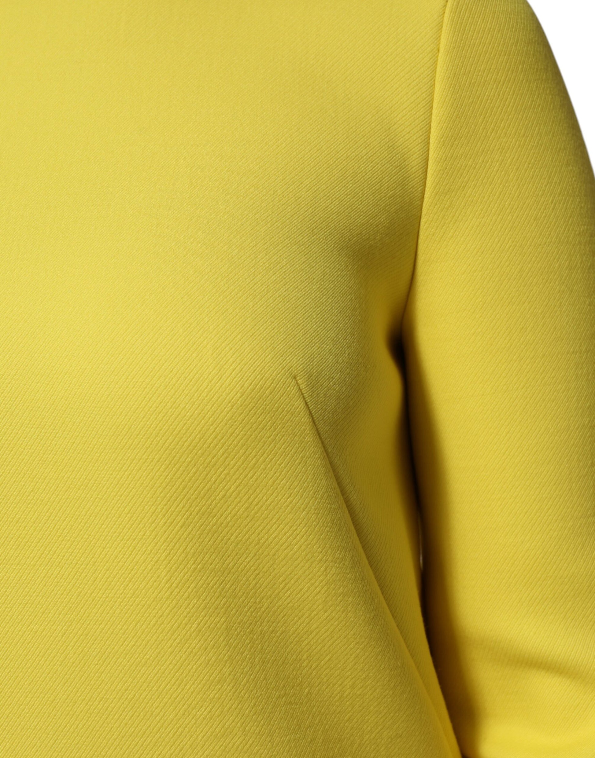 A yellow viscose acetate mini long sleeve dress